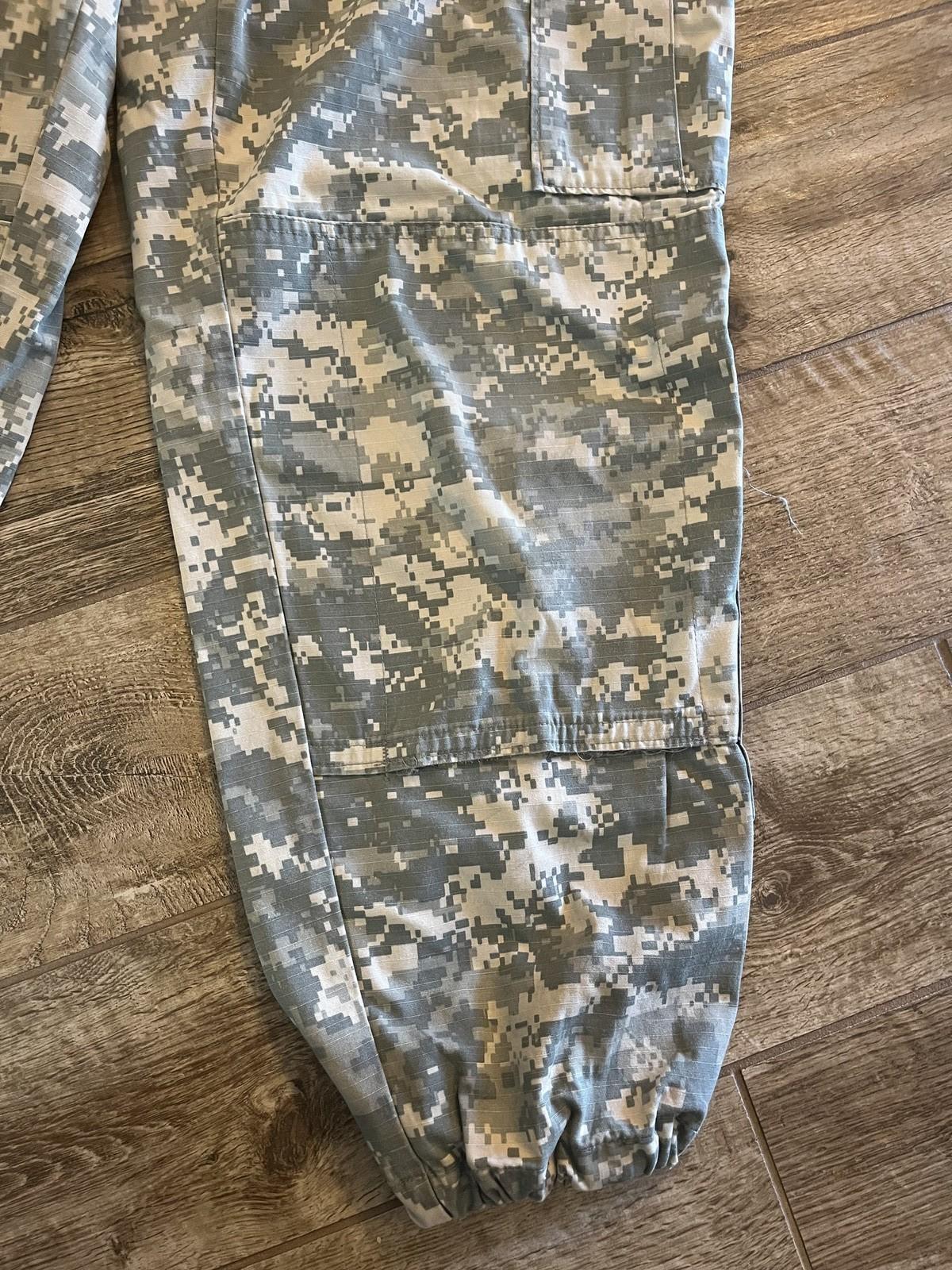 US Military ACU digital camo cargo pants by Centex Military Gear, medium short size, used and altered, with multiple pockets and durable fabric.