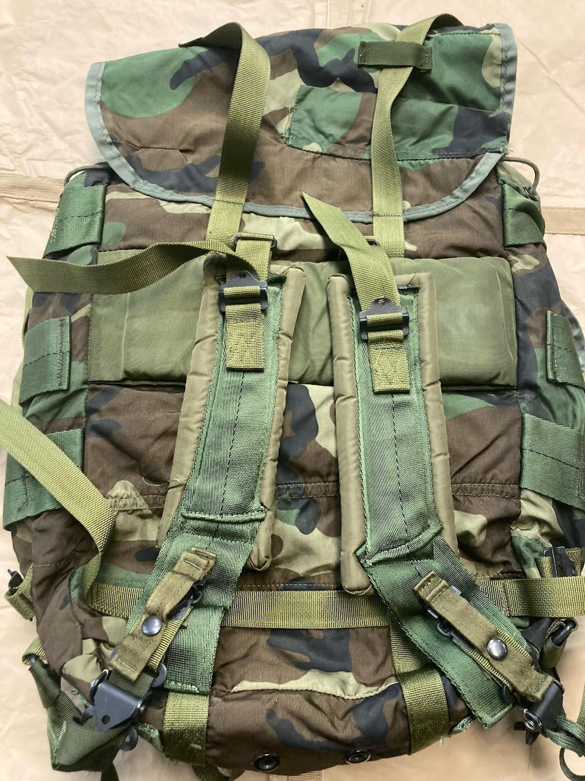 Woodland camo radio carrying case for M81 tactical backpack, made by Centex Military Gear, with adjustable straps and durable fabric.