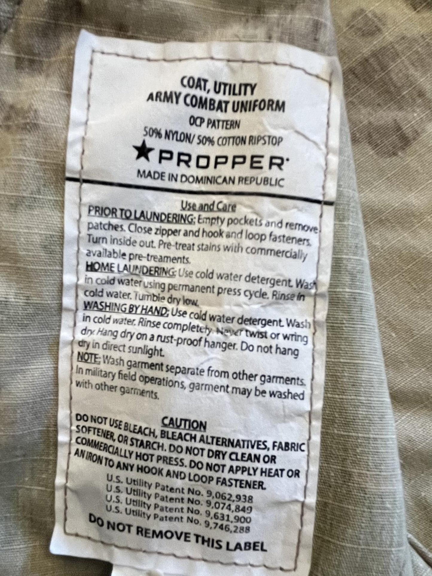 Propper Female Scorpion OCP Army combat uniform coat made of ripstop fabric with front pockets and military design.