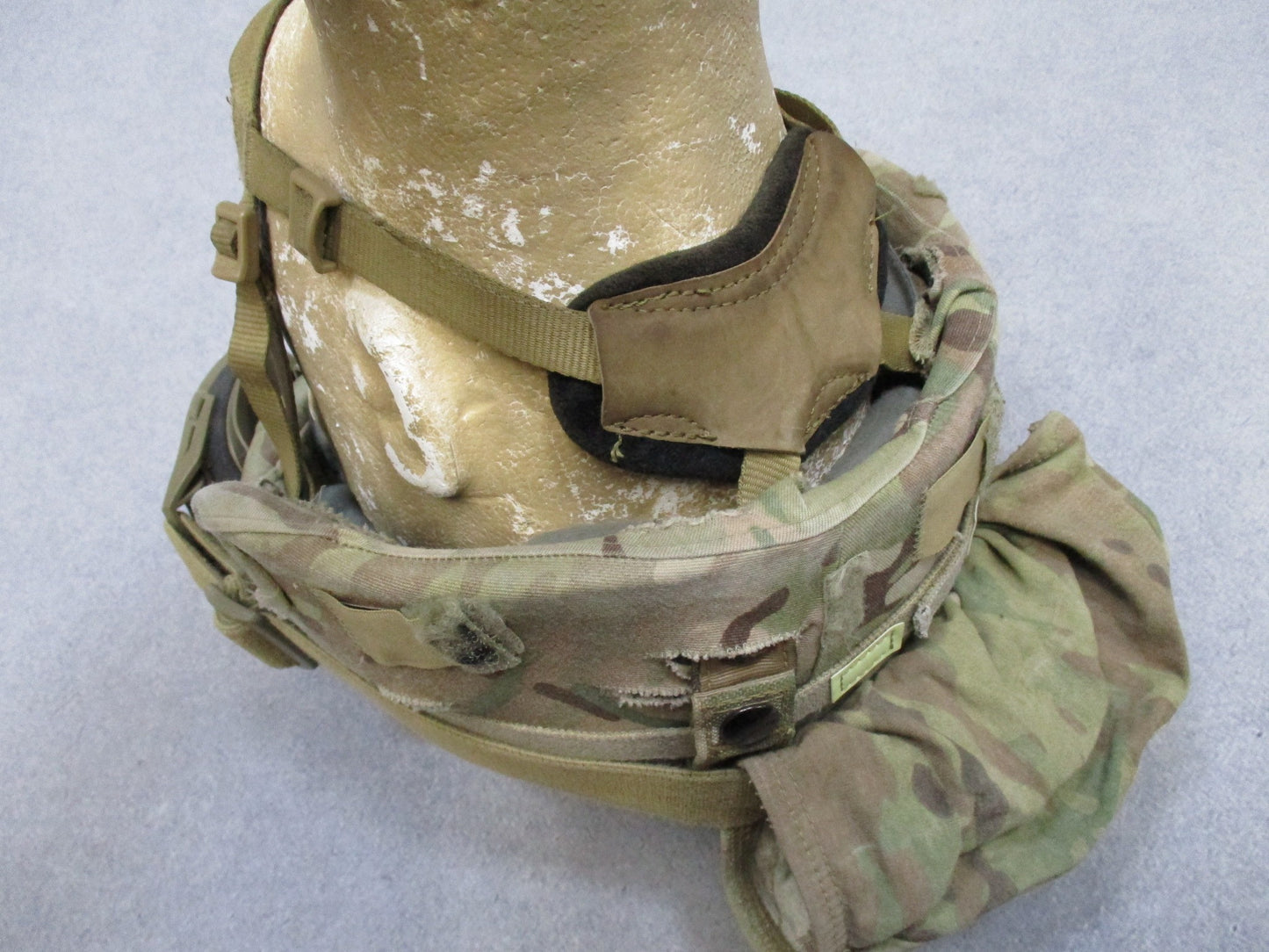 USGI ACH combat helmet in size medium with BAE Systems pads, NVG mount, goggles, and cat eye features for military use.