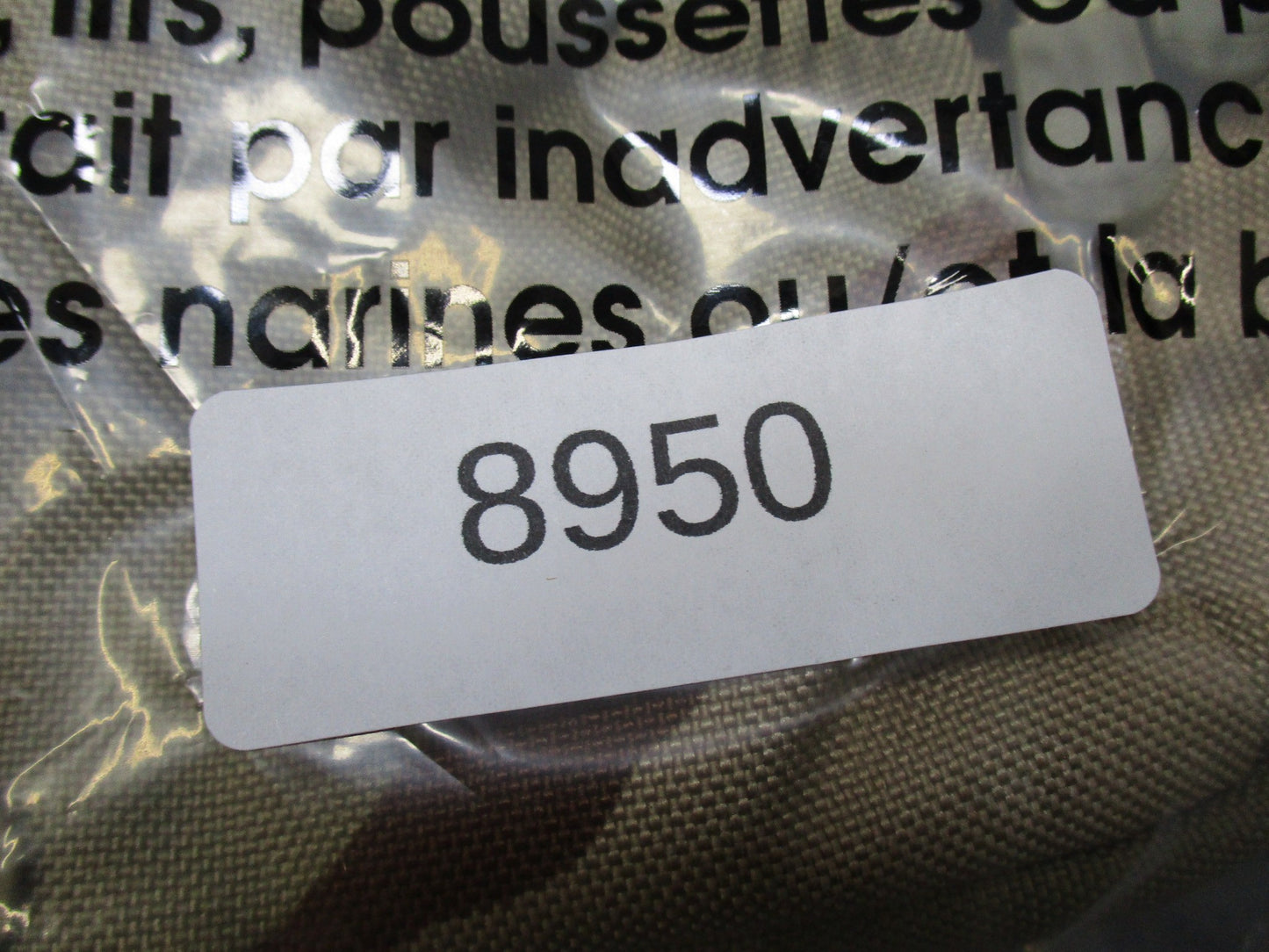 CamelBak MULE hydration pack in desert tan tactical backpack with hydration carrier and multiple compartments.