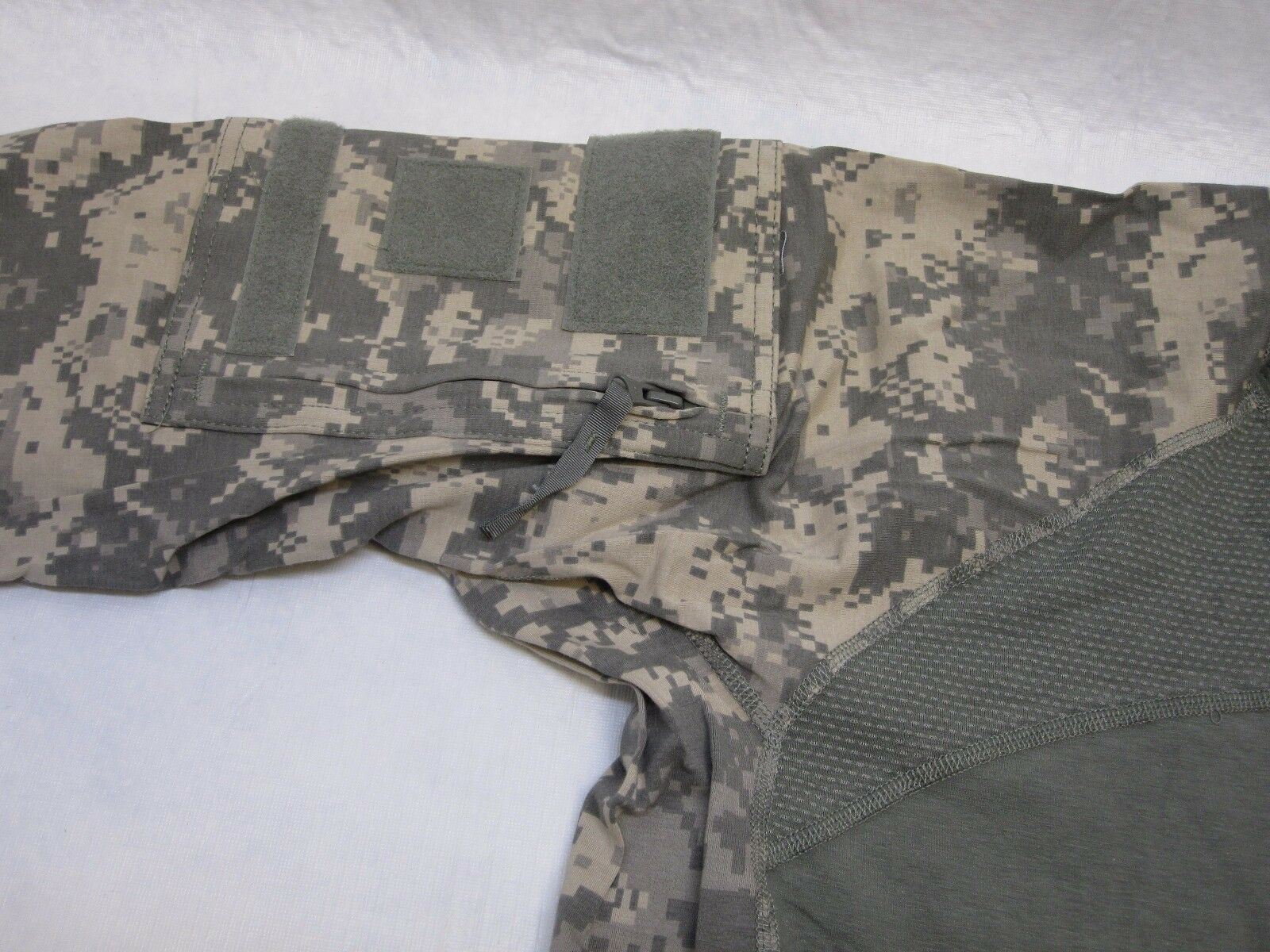 Digital camouflage combat shirt by Centex Military Gear with flame-resistant fabric and large front emblem logo.
