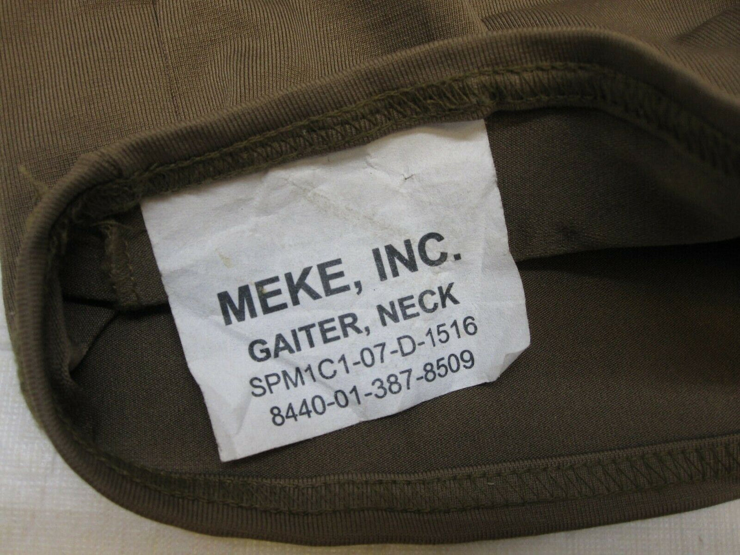 Brown USGI military neck gaiter face warmer made of polyester, designed for outdoor and tactical use by Centex Military Gear.