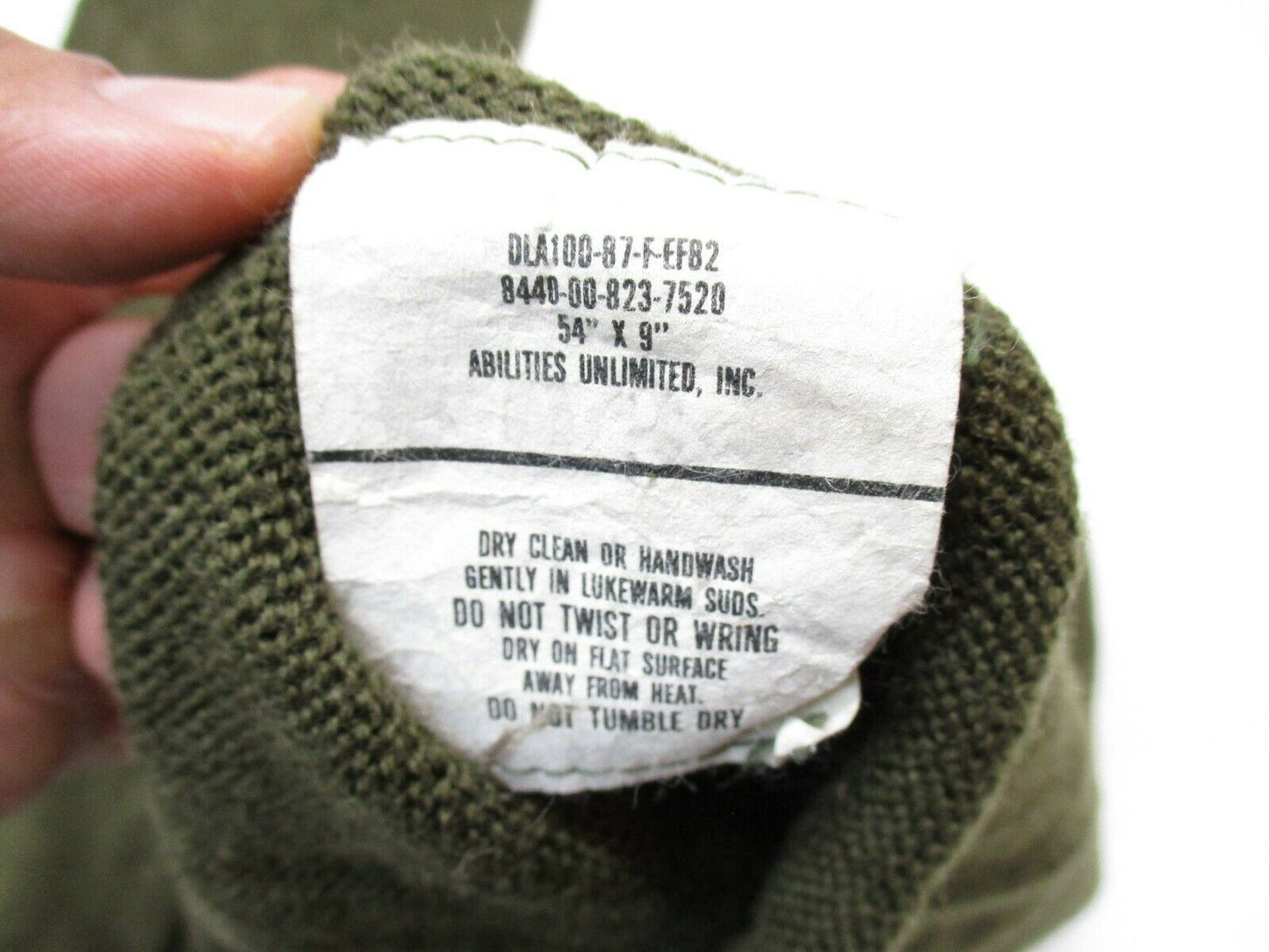 USGI military OD green wool scarf or neck warmer by Centex Military Gear, featuring a tube design and rugged wool material.