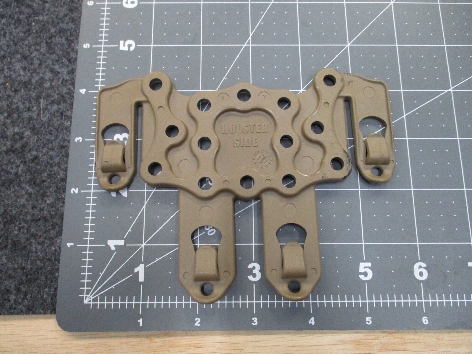 Blackhawk MOLLE adapter platform for army and USMC Serpa CQC holsters in coyote tan, compatible with military gear.