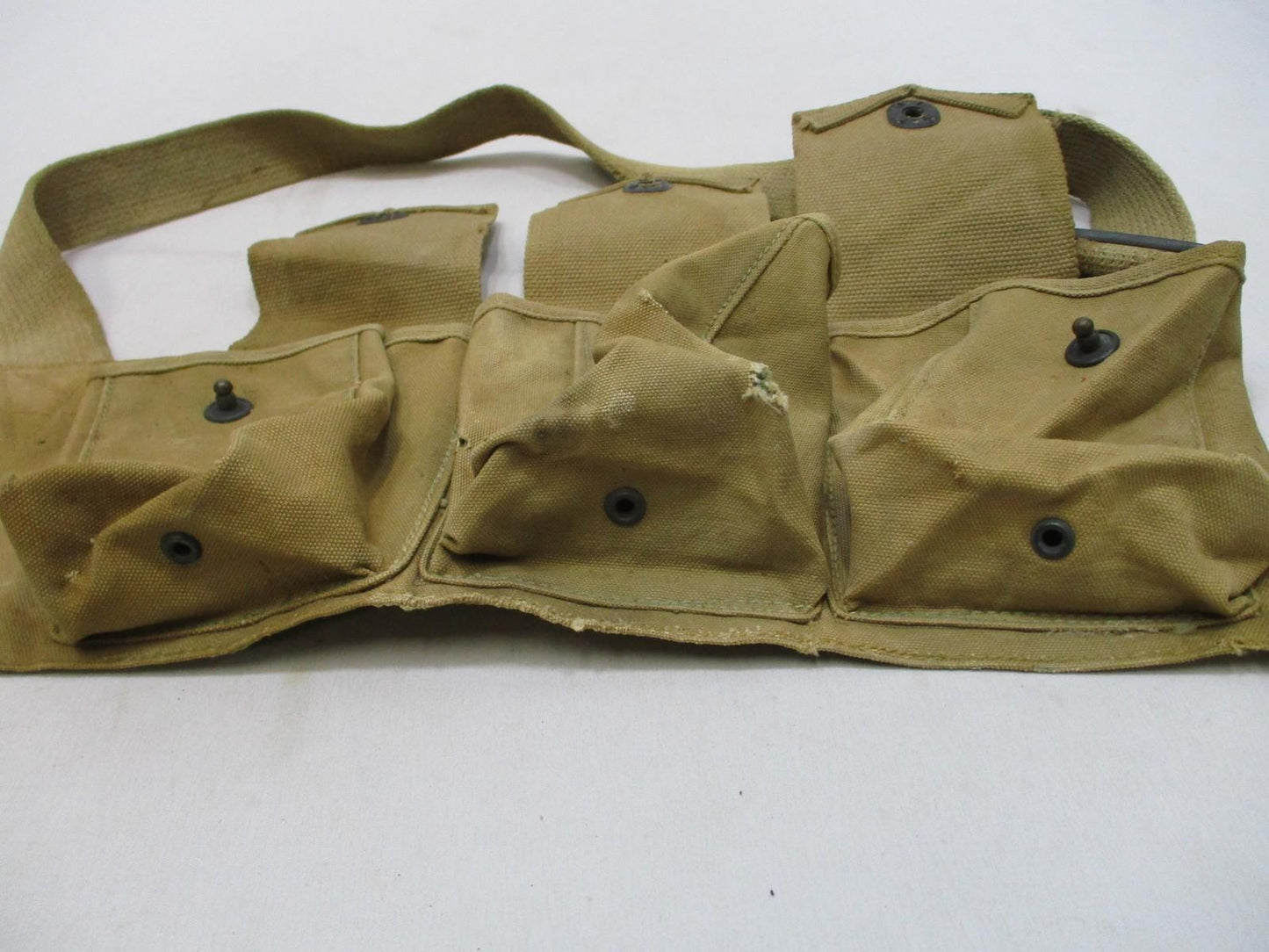Vintage WWI era bandolier pouch by Centex Military Gear, canvas military web gear with right-side design and metal clips.