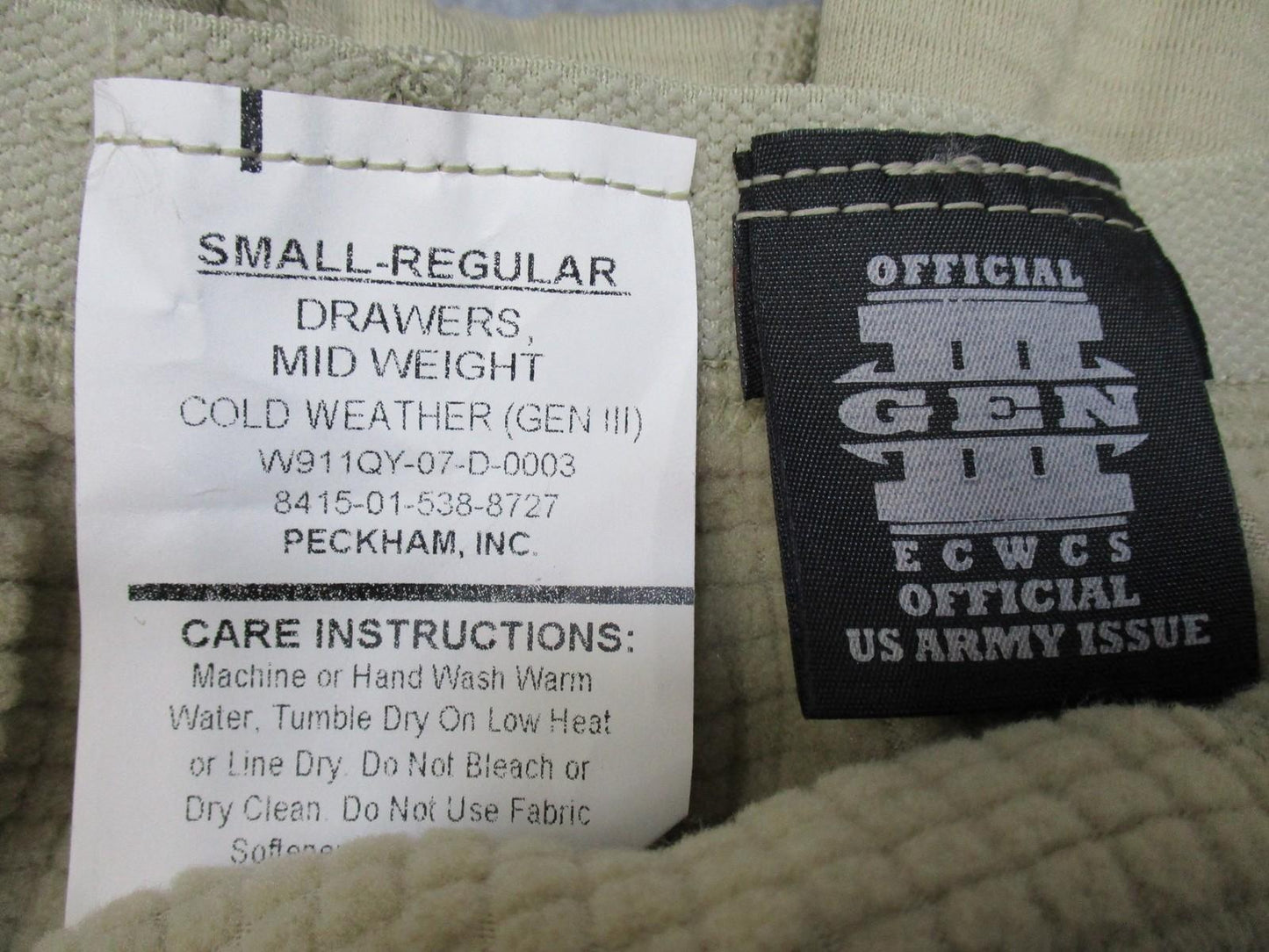 ECWCS GEN III Thermal Waffle Pants in Small-Regular, US Army issue, featuring a textured fabric for cold weather insulation.