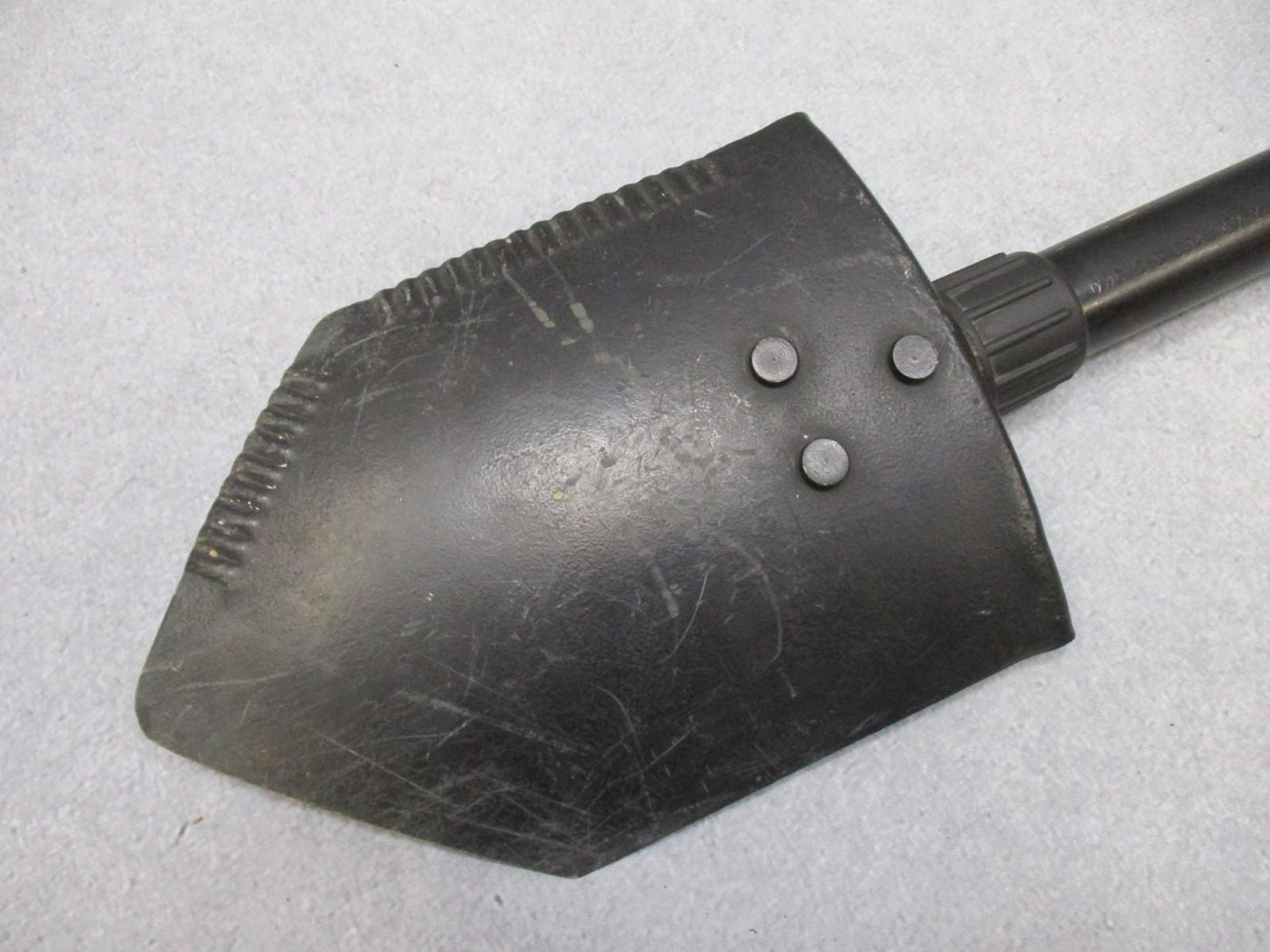 Centex Military Gear Ames folding shovel with pouch, featuring serrated edge, used for camping and hiking, U.S. military E-Tool