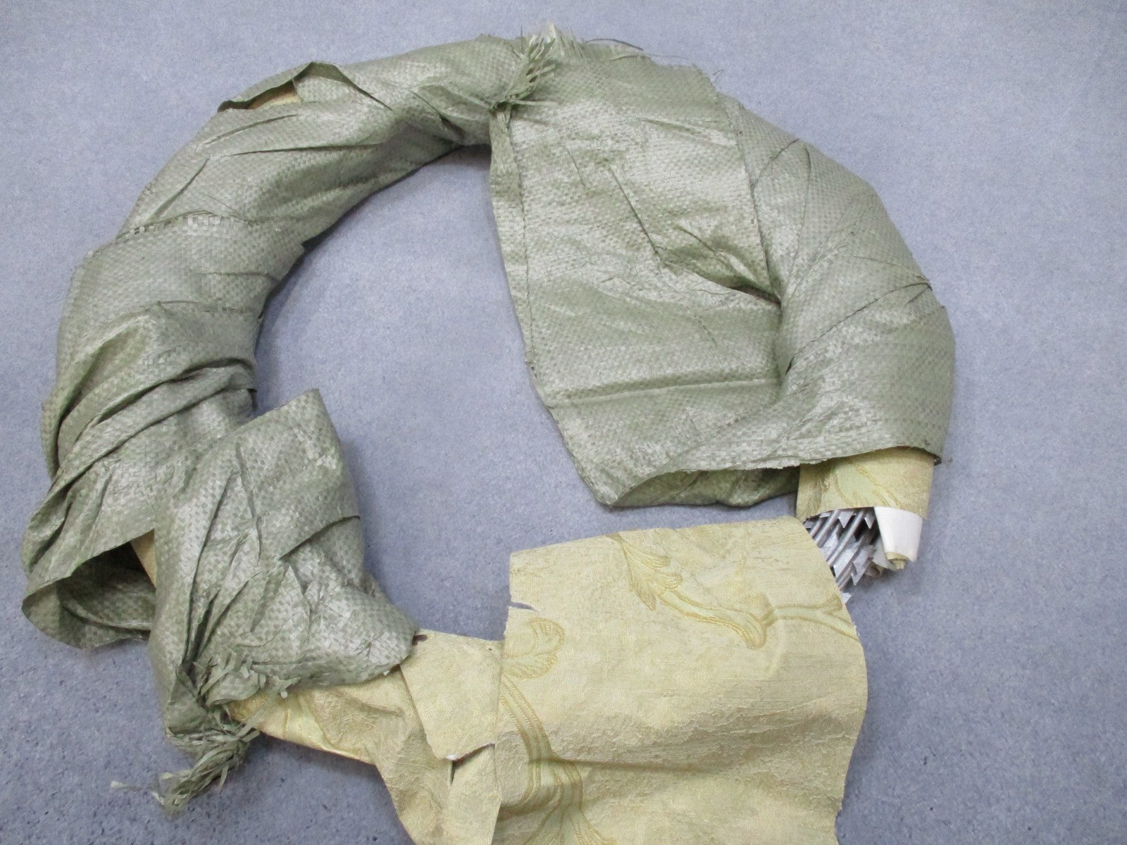 Vintage USGI military concertina barbed wire coil, 24-inch, unused perimeter security wire from Centex Military Gear.