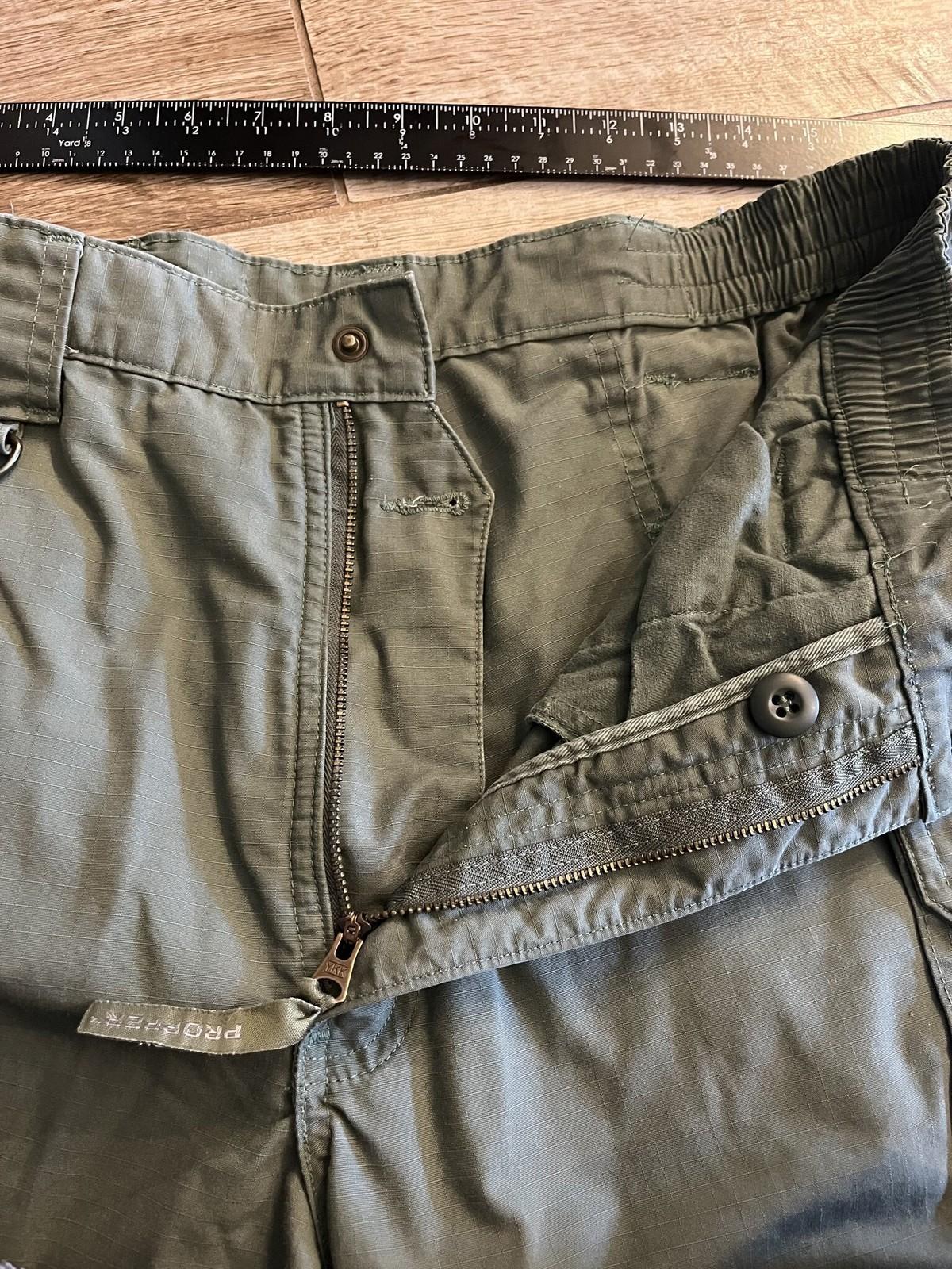Men's Propper tactical cargo pants in olive drab ripstop fabric, size 36/34, with multiple pockets and durable military-style design.