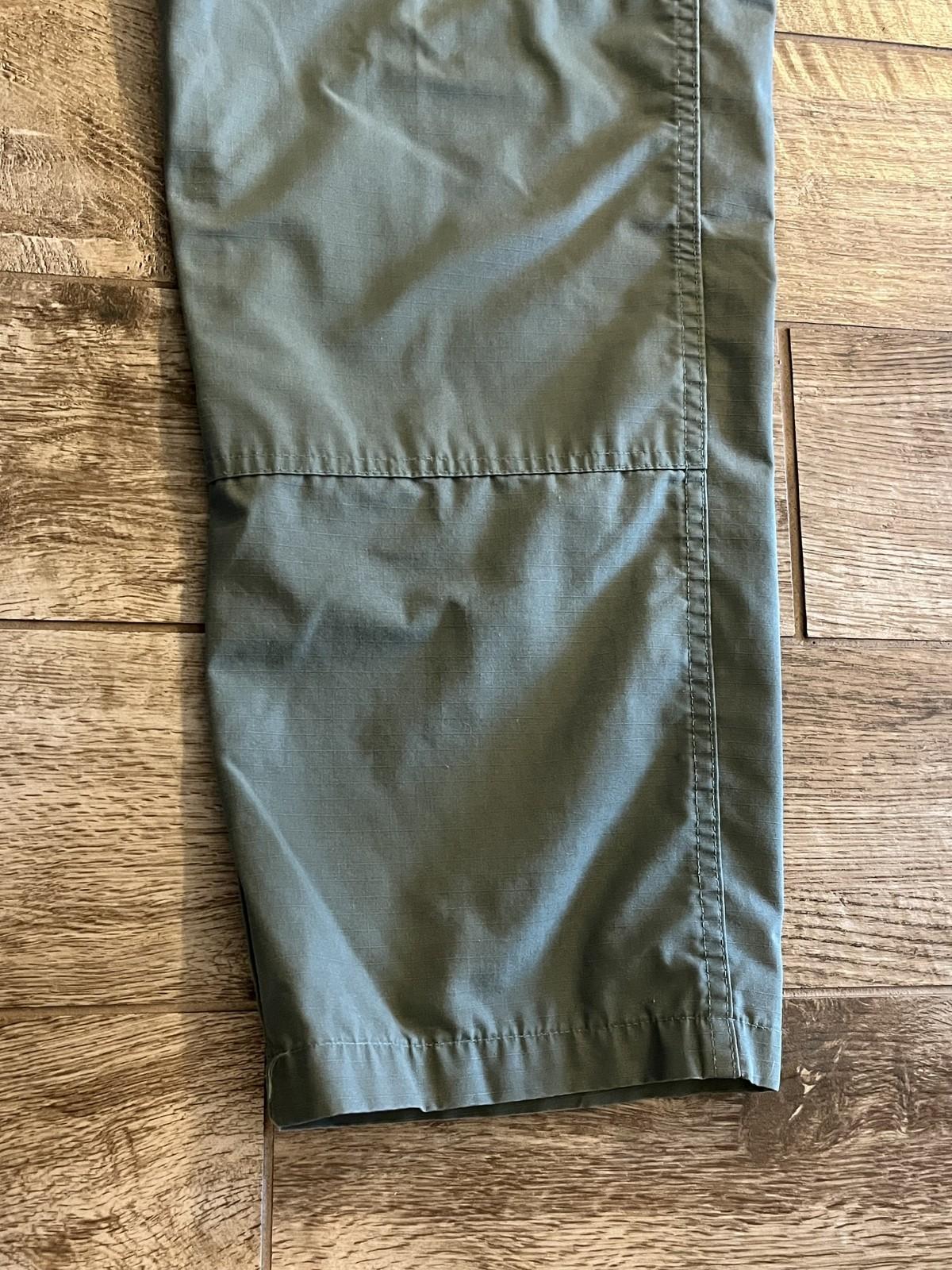 Men's Propper tactical cargo pants in olive drab ripstop, size 36/34, with multiple pockets and reinforced fabric for durability.