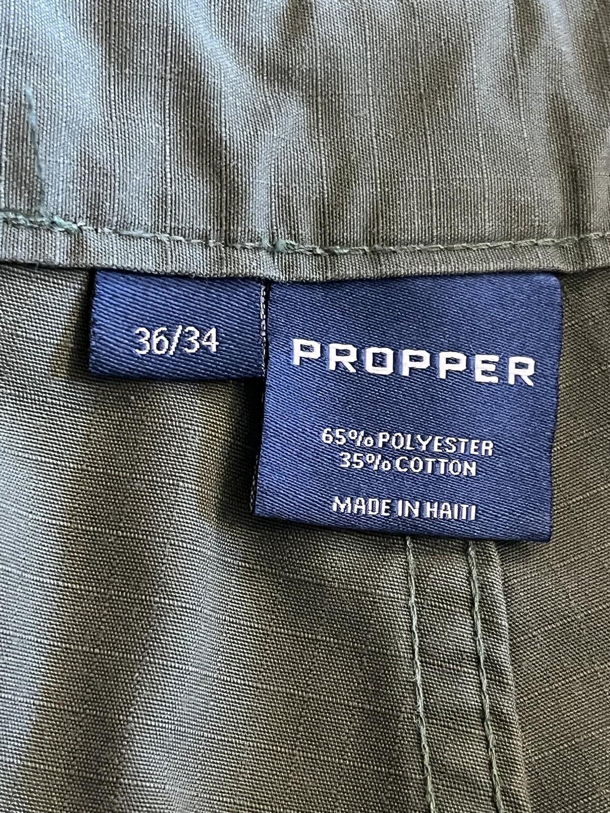 Men's Propper tactical cargo pants in olive drab ripstop fabric, size 36/34, featuring multiple pockets and durable military-style design.