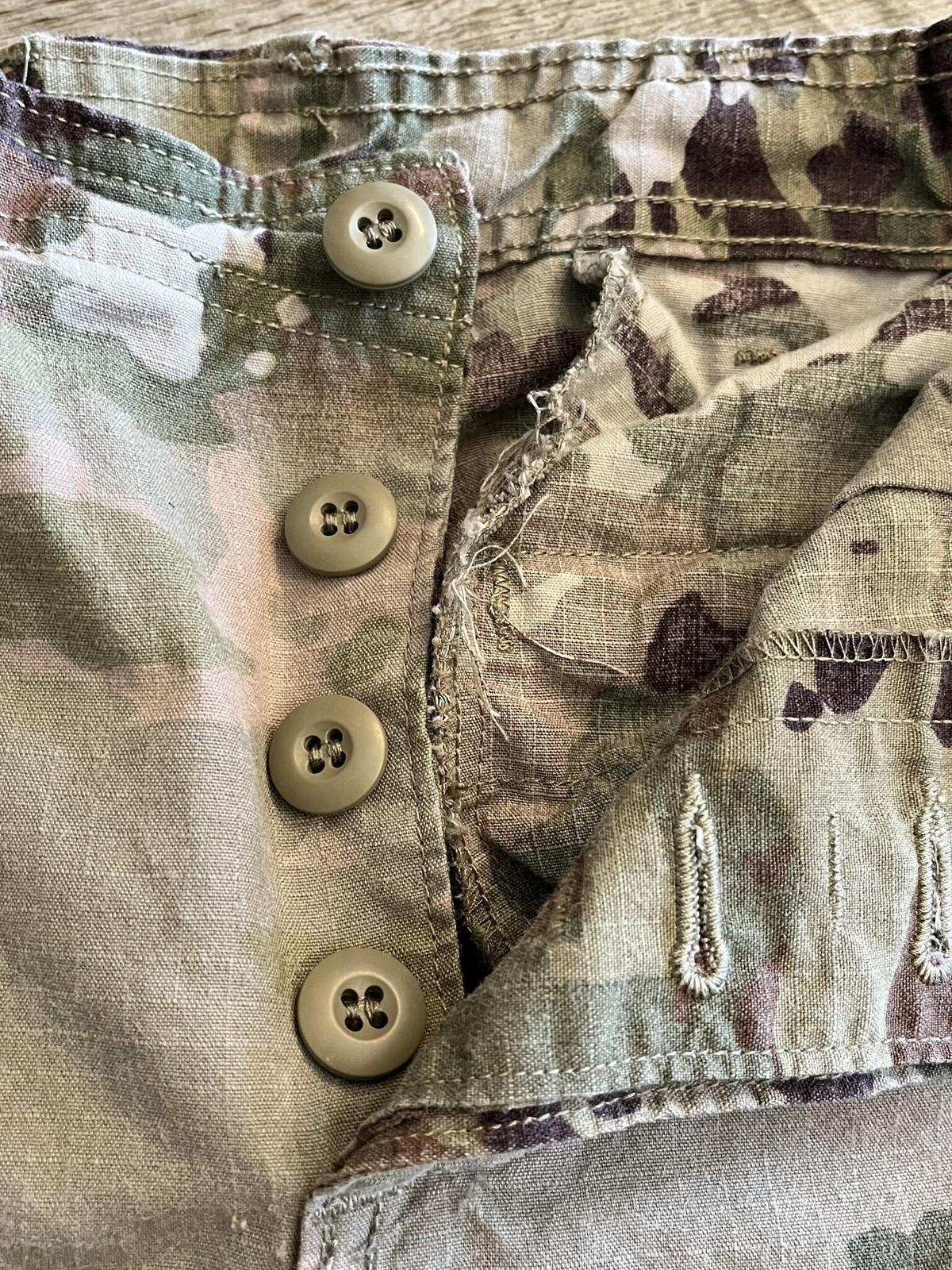 US Army OCP Scorpion combat uniform female FR cargo pants, size 28 regular, by Centex Military Gear, shown on a hanger.