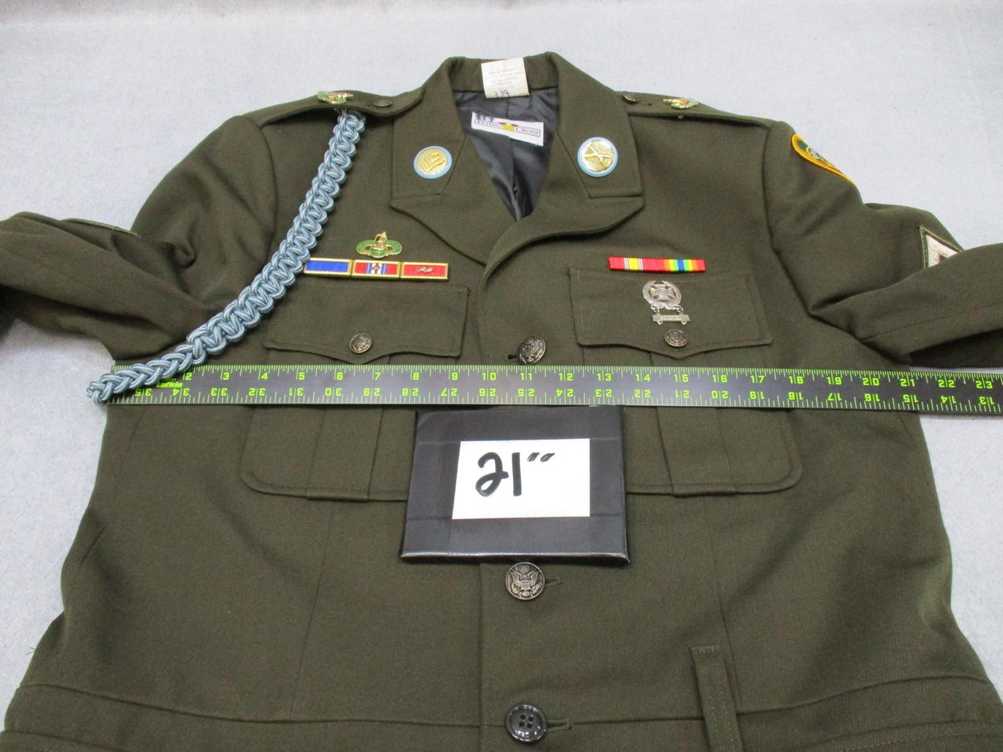 US Army AGSU service dress coat jacket in heritage green with ribbons, shown with front view and military insignia.