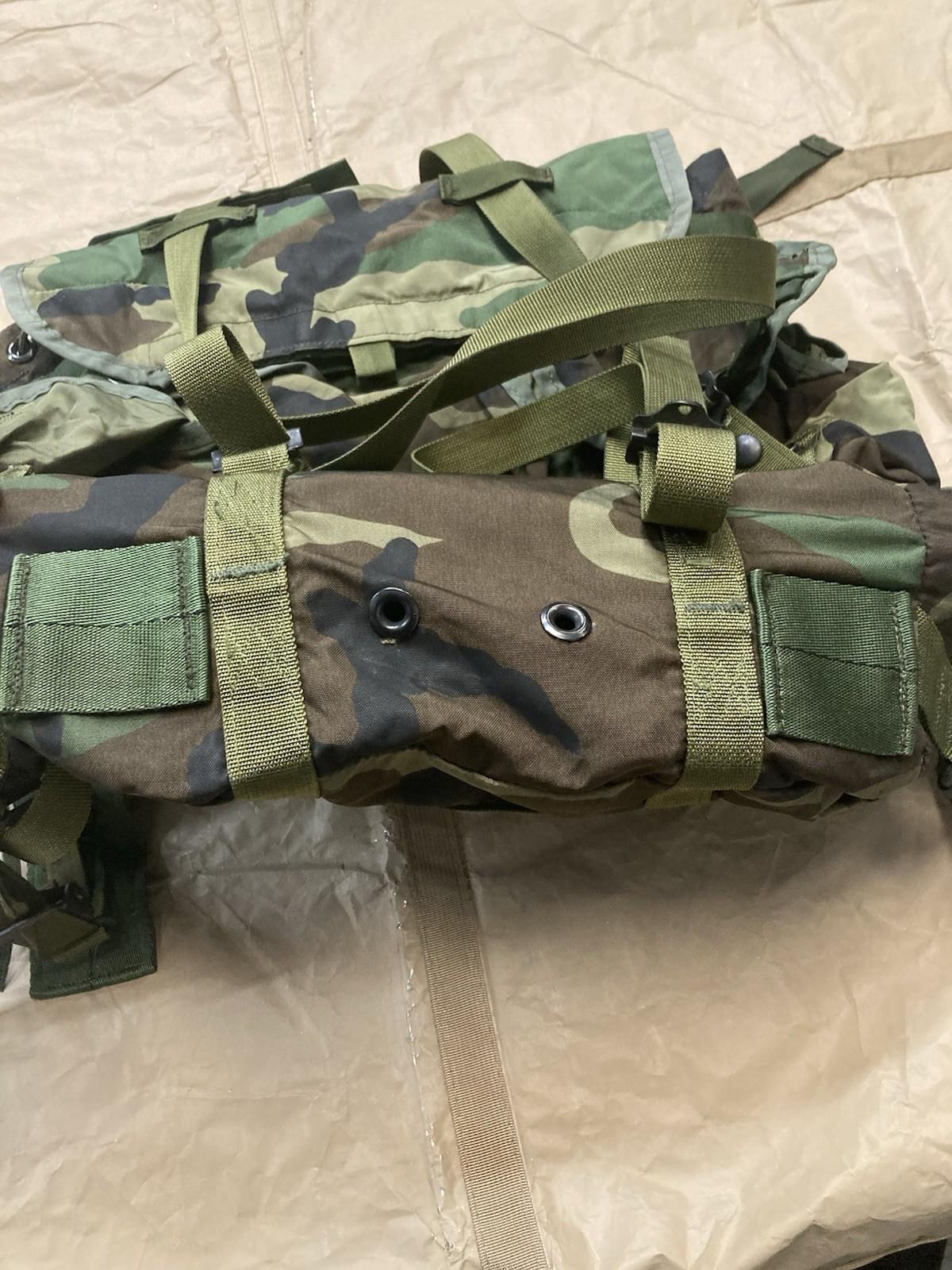 Centex Military Gear woodland camo radio carrying case with a tactical M81 Alice Pack backpack, featuring multiple compartments and adjustable straps.