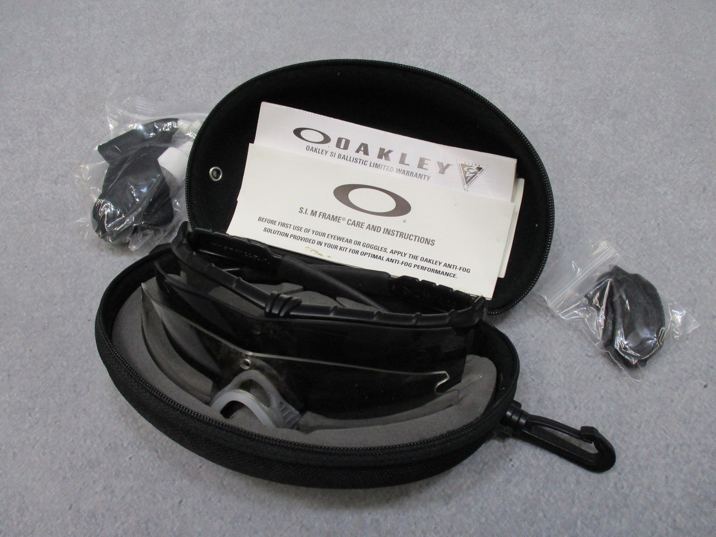 Oakley SI M Frame 2.0 ballistic safety glasses kit with multiple lenses and case, designed for military and tactical use