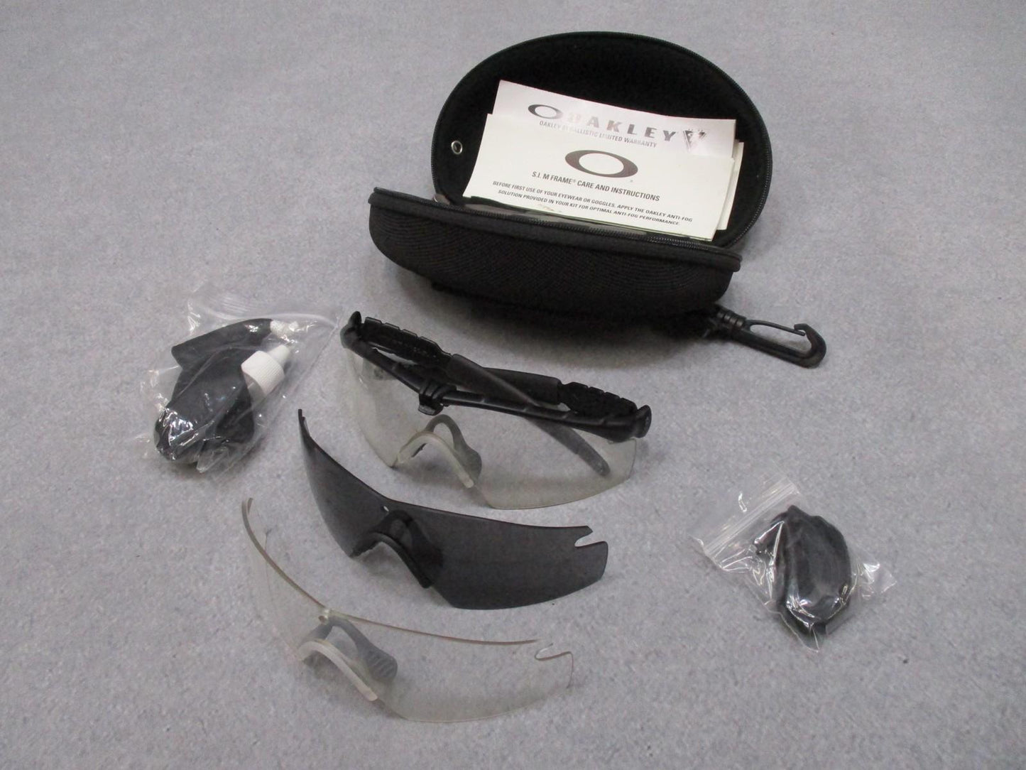 Centex Military Gear Oakley SI M Frame 2.0 ballistic safety glasses kit with multiple lenses and case, showing clear and tinted lenses.
