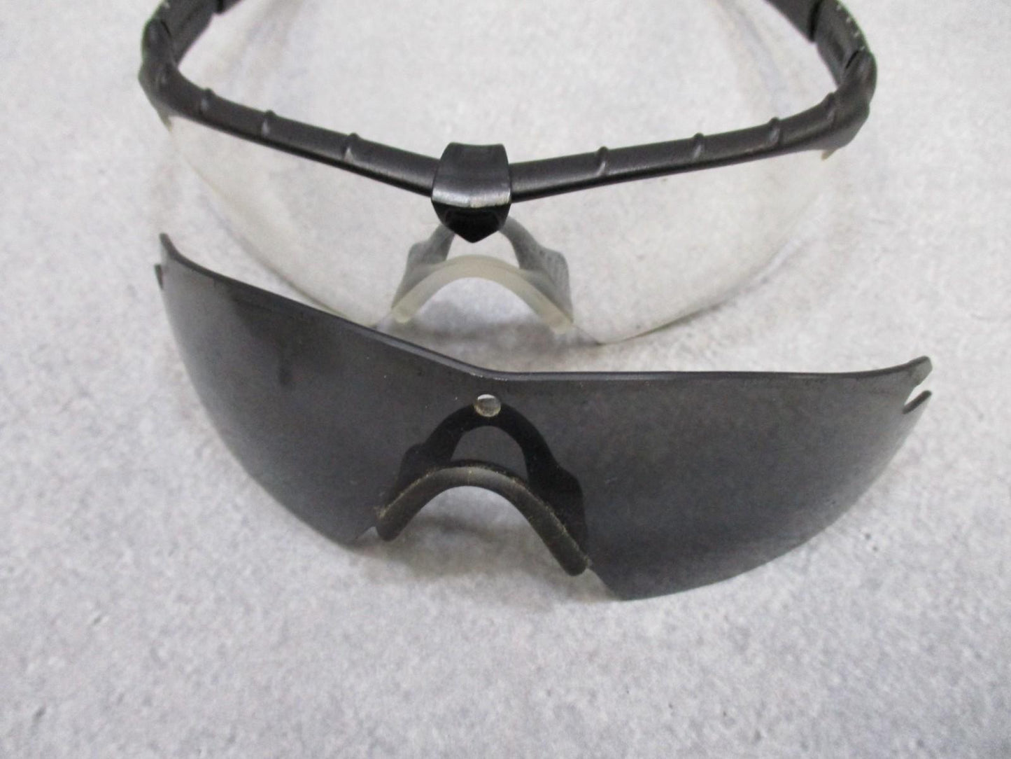 Military Oakley SI Frame 2.0 safety glasses with multi-lens kit and case, featuring Z87+ ANSI protection and durable design.