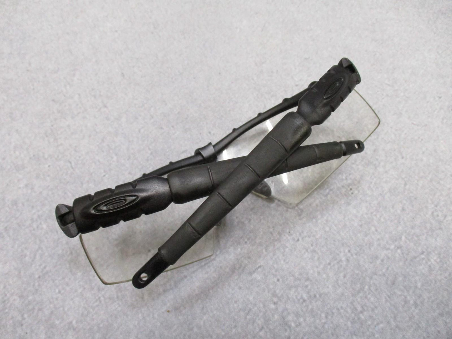 Military Oakley SI Frame 2.0 safety glasses with multi-lens kit and case, featuring Z87+ ANSI certification for eye protection.