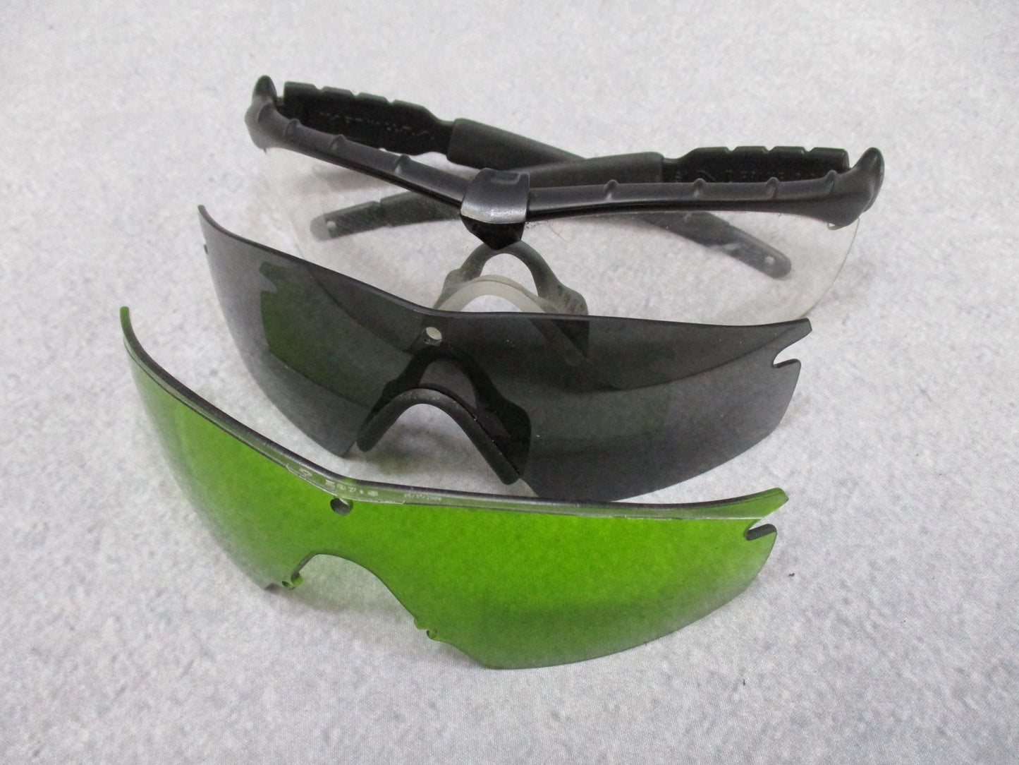Military Oakley SI M Frame 2.0 shooting safety glasses with case and three lenses, designed for tactical and shooting use.