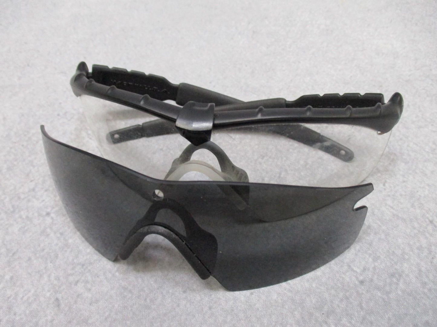 Military Oakley SI M Frame 2.0 shooting safety glasses with case and three lenses, designed for tactical and shooting safety.