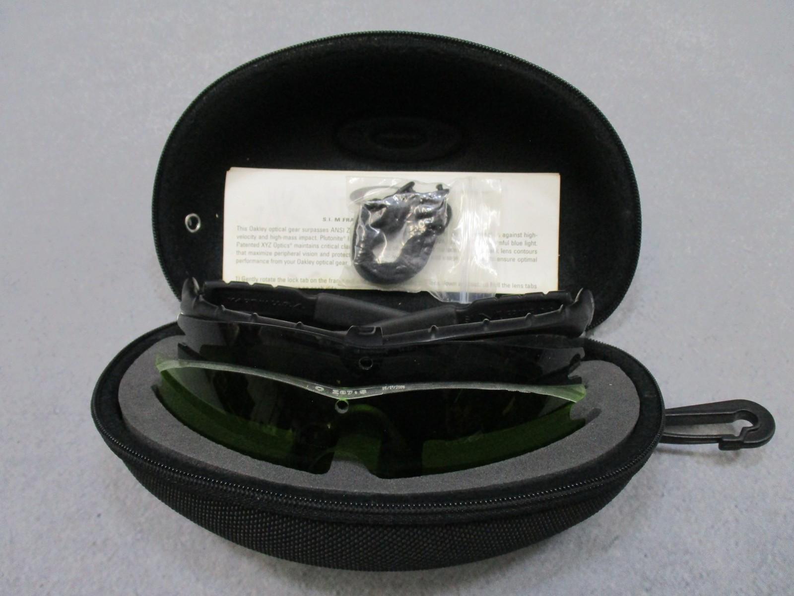 Military Oakley SI M Frame 2.0 shooting safety glasses with case and three lenses, designed for tactical and shooting use.