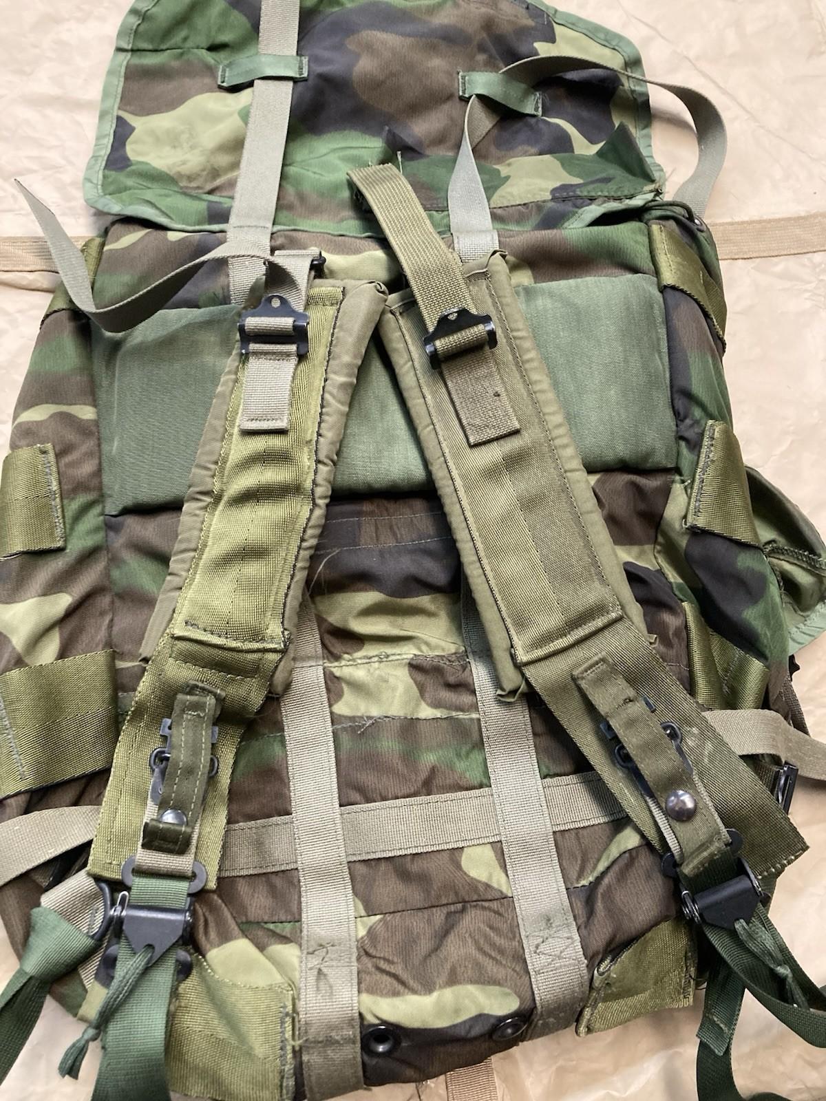 Centex Military Gear Alice Pack radio carrying case on woodland assault pack, showing durable fabric and secure compartments.