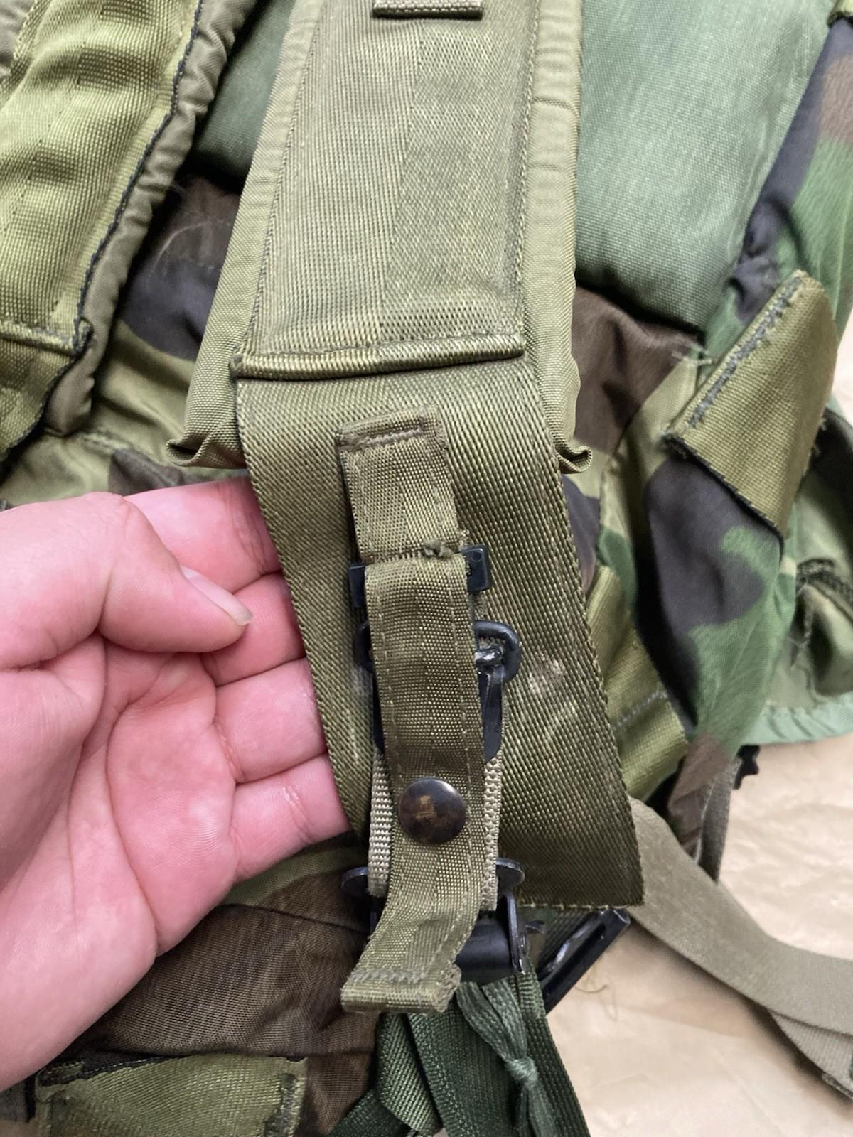 Centex Military Gear Alice Pack radio carrying case attached to M81 Woodland assault pack with multiple compartments and straps.