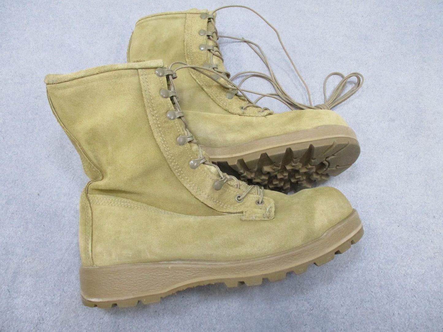 Desert tan Altama USGI military combat boots with suede uppers, size 11.5W, Vibram sole, worn by soldiers in rugged terrain.
