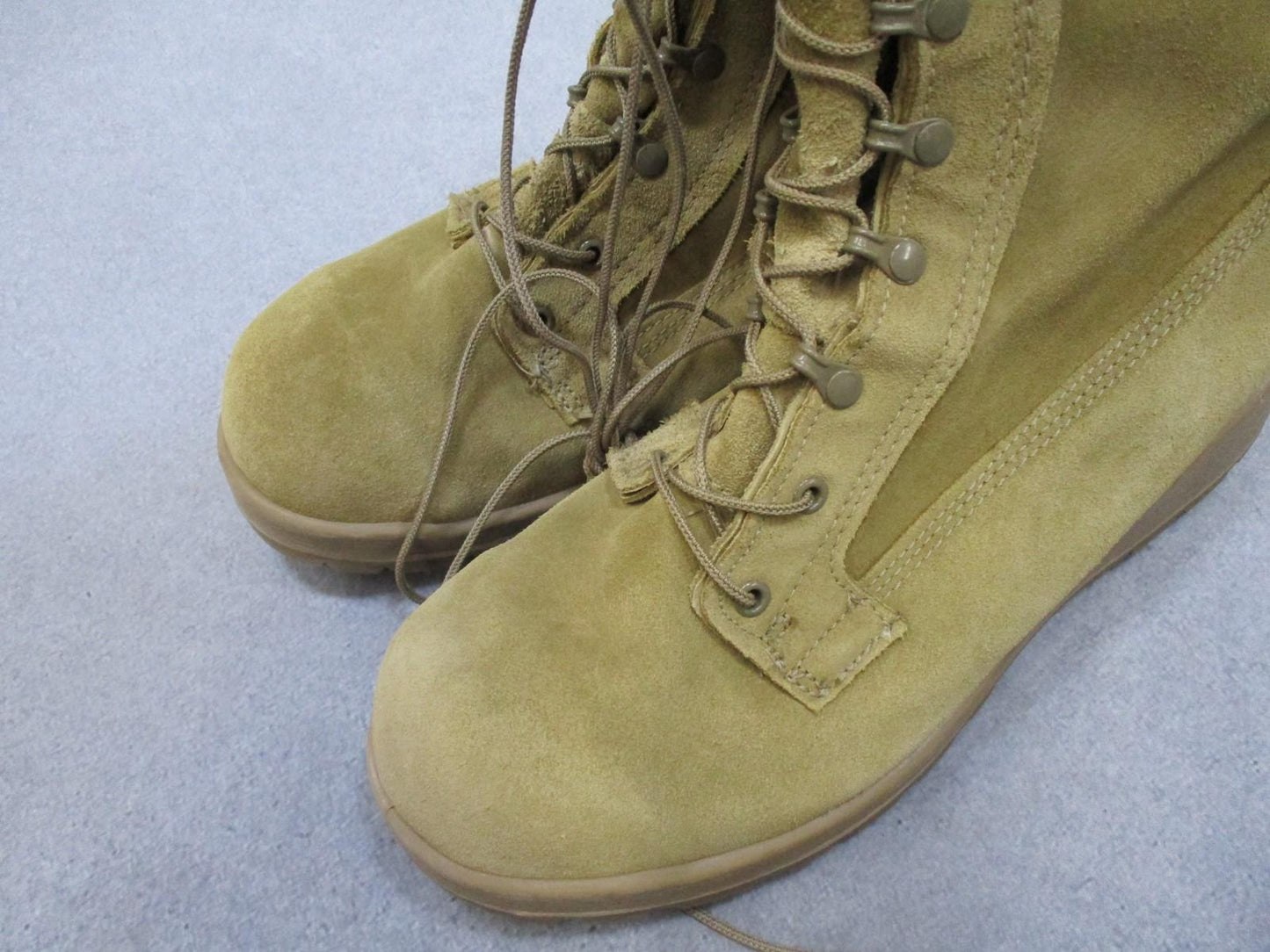 Desert tan Altama USGI military combat boots in size 11.5 with suede upper and Vibram sole, designed for tactical use.