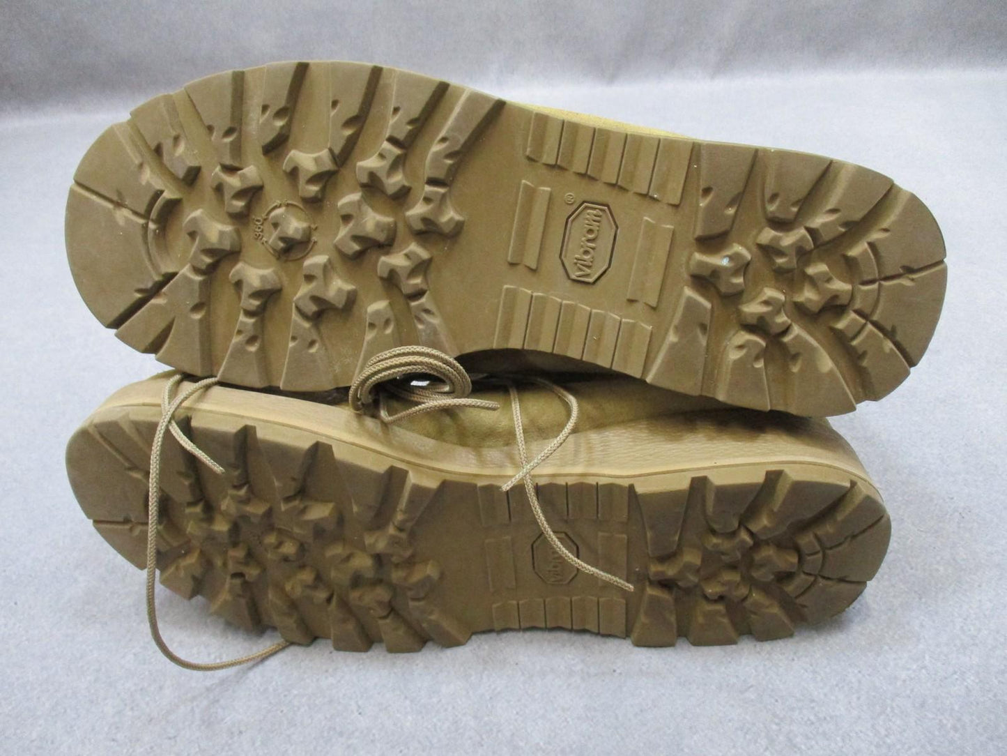 Desert tan Altama USGI military combat boots in size 11.5W with suede upper and Vibram sole, designed for rugged outdoor use.