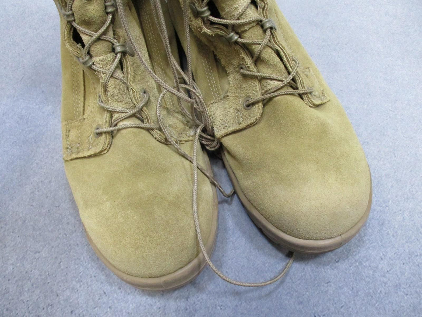 Desert tan Altama USGI military combat boots in size 11.5W with suede upper and Vibram sole, designed for rugged outdoor use.