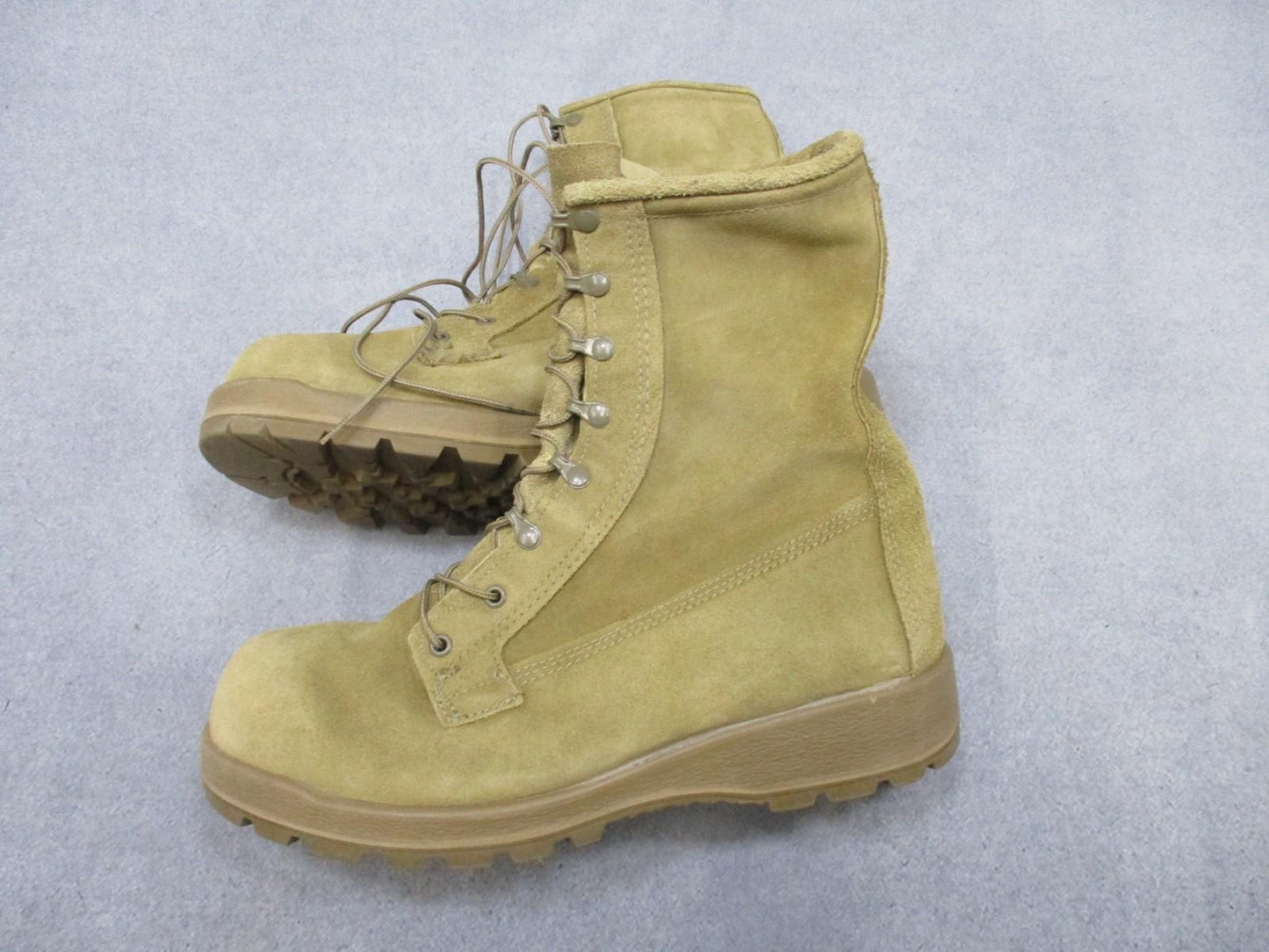 Desert tan Altama USGI Army combat boots in size 11.5 W with suede upper and Vibram sole, designed for military use.