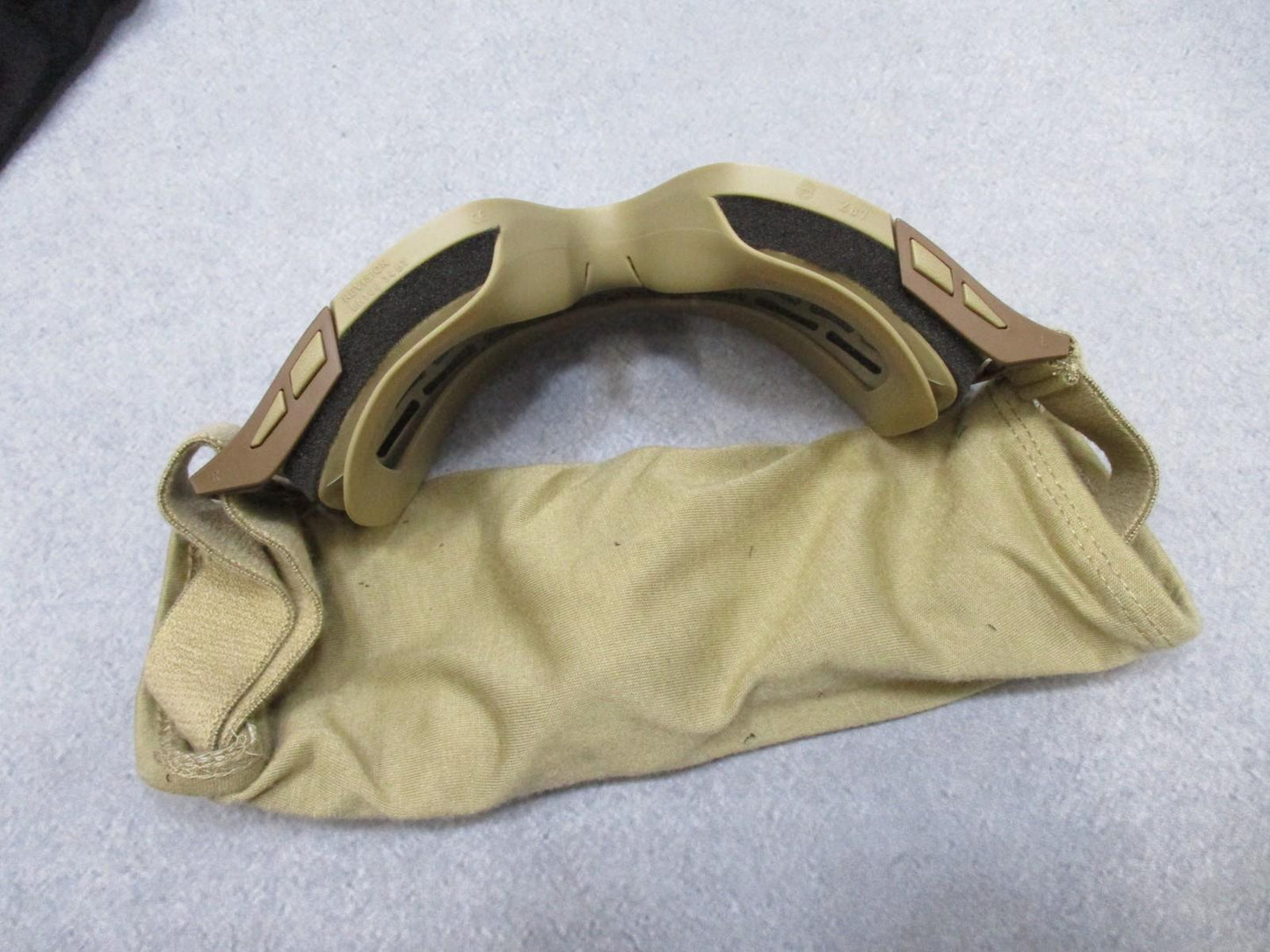 Revision Military Desert Locust goggles with clear lens, adjustable strap, and carrying pouch, used in excellent condition.