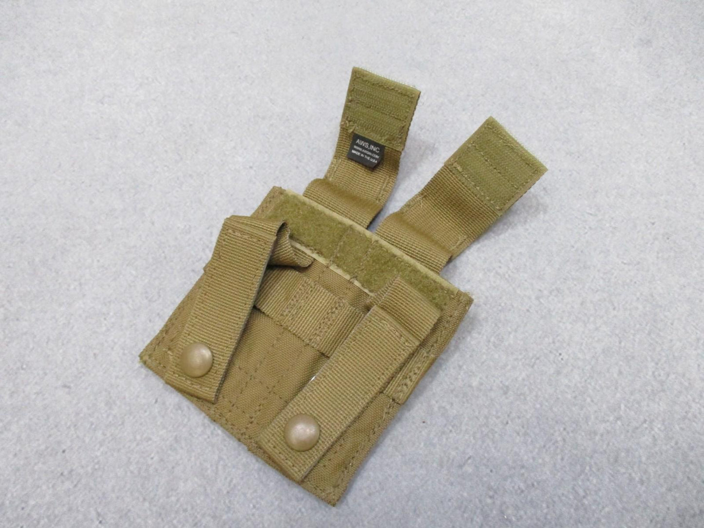 Used AWS Inc. double pistol magazine pouch by Centex Military Gear with MOLLE attachment in coyote color, made in USA.