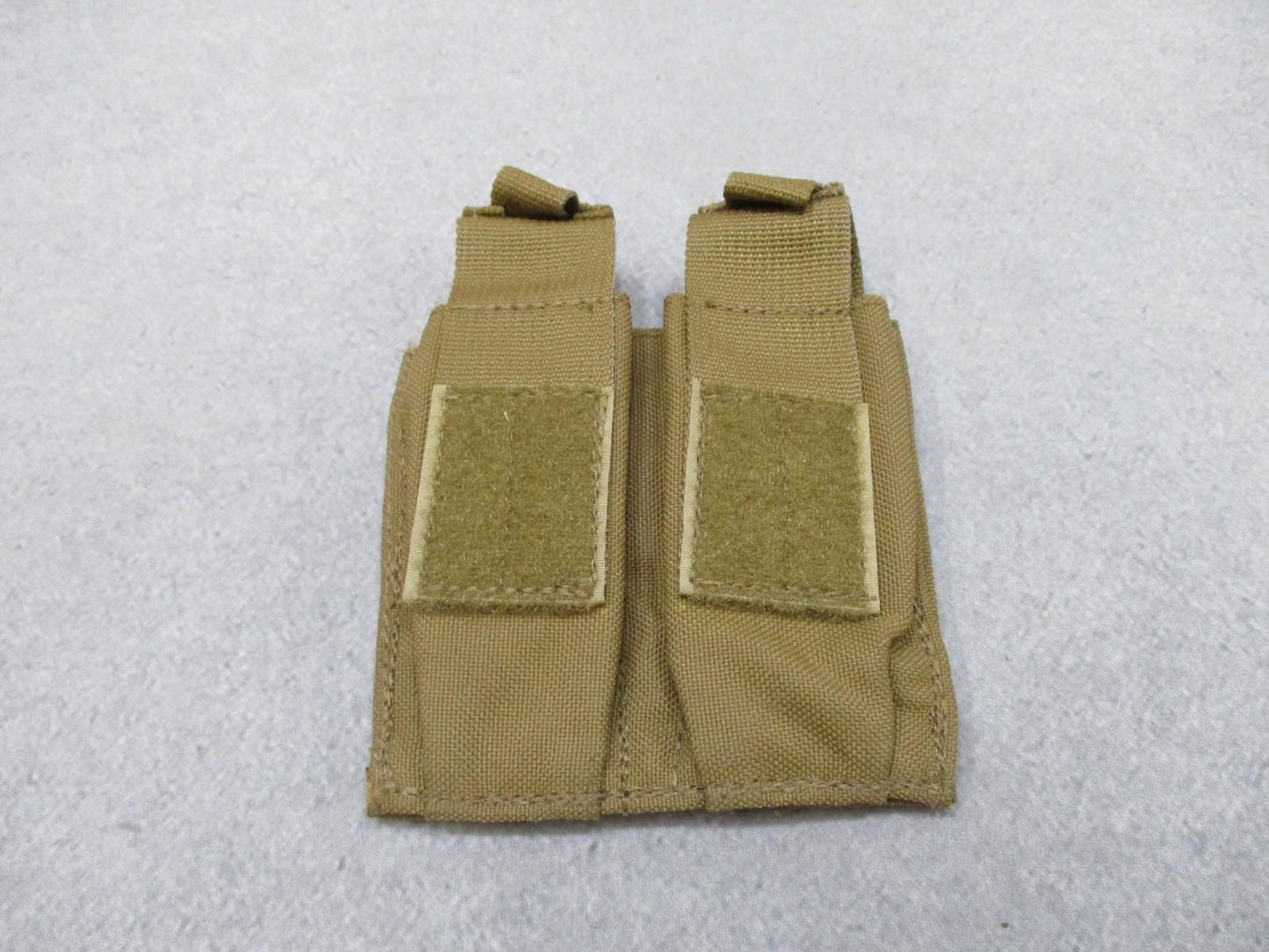Used AWS Inc. double pistol magazine pouch by Centex Military Gear, MOLLE coyote nylon, designed for tactical firearm storage.