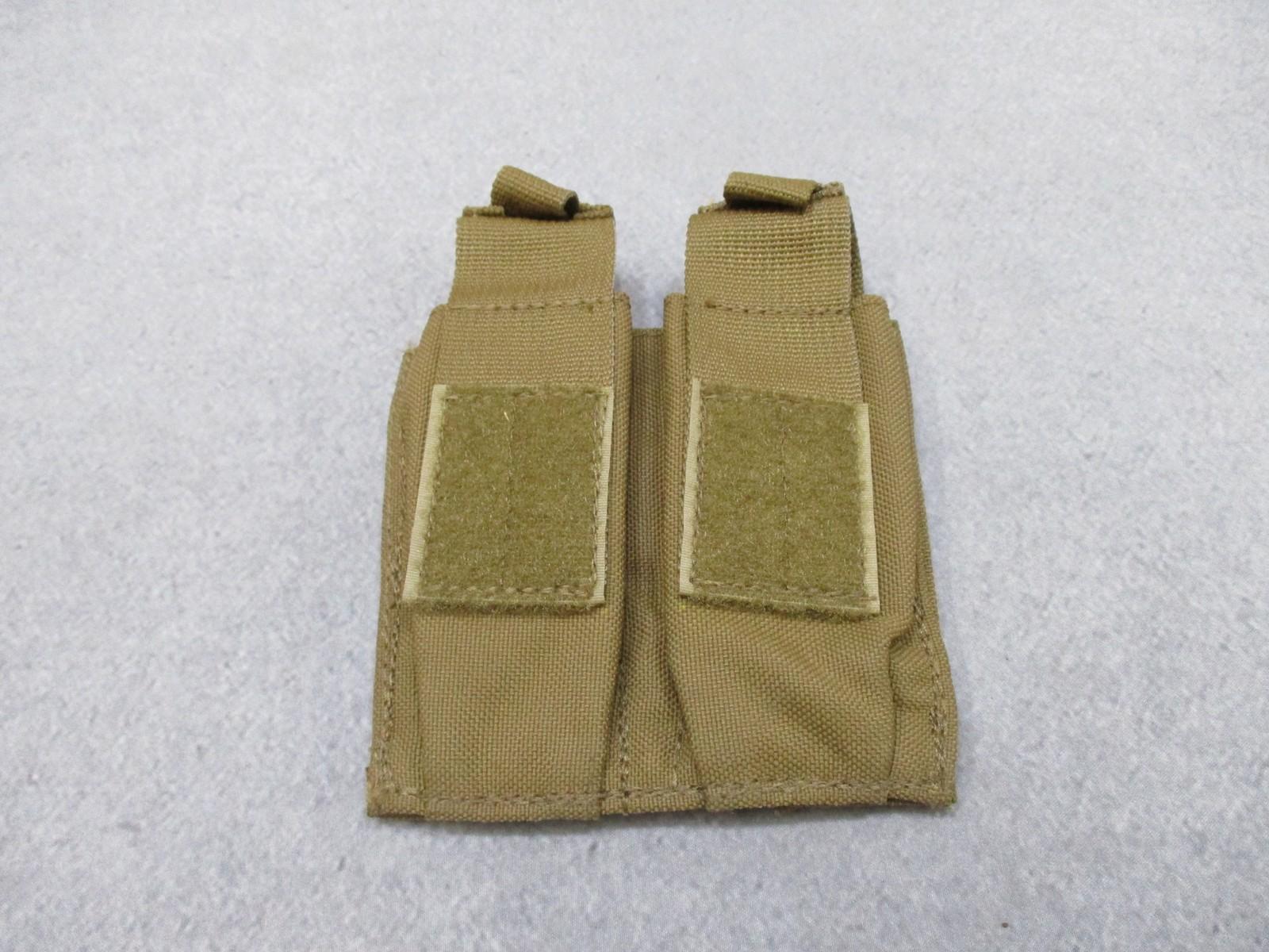 Used AWS Inc. double pistol magazine pouch by Centex Military Gear, MOLLE coyote nylon, designed for tactical firearm storage.