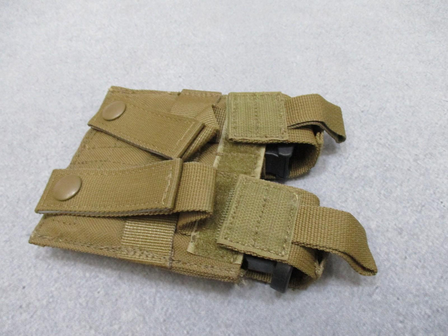 Used AWS Inc. Double pistol magazine pouch by Centex Military Gear in coyote, MOLLE-compatible, made in USA, very good condition.