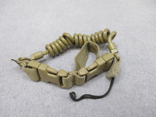 Tan coiled Gem-Tech pistol lanyard dummy cord from Centex Military Gear, designed for tactical duty gear and firearm security.