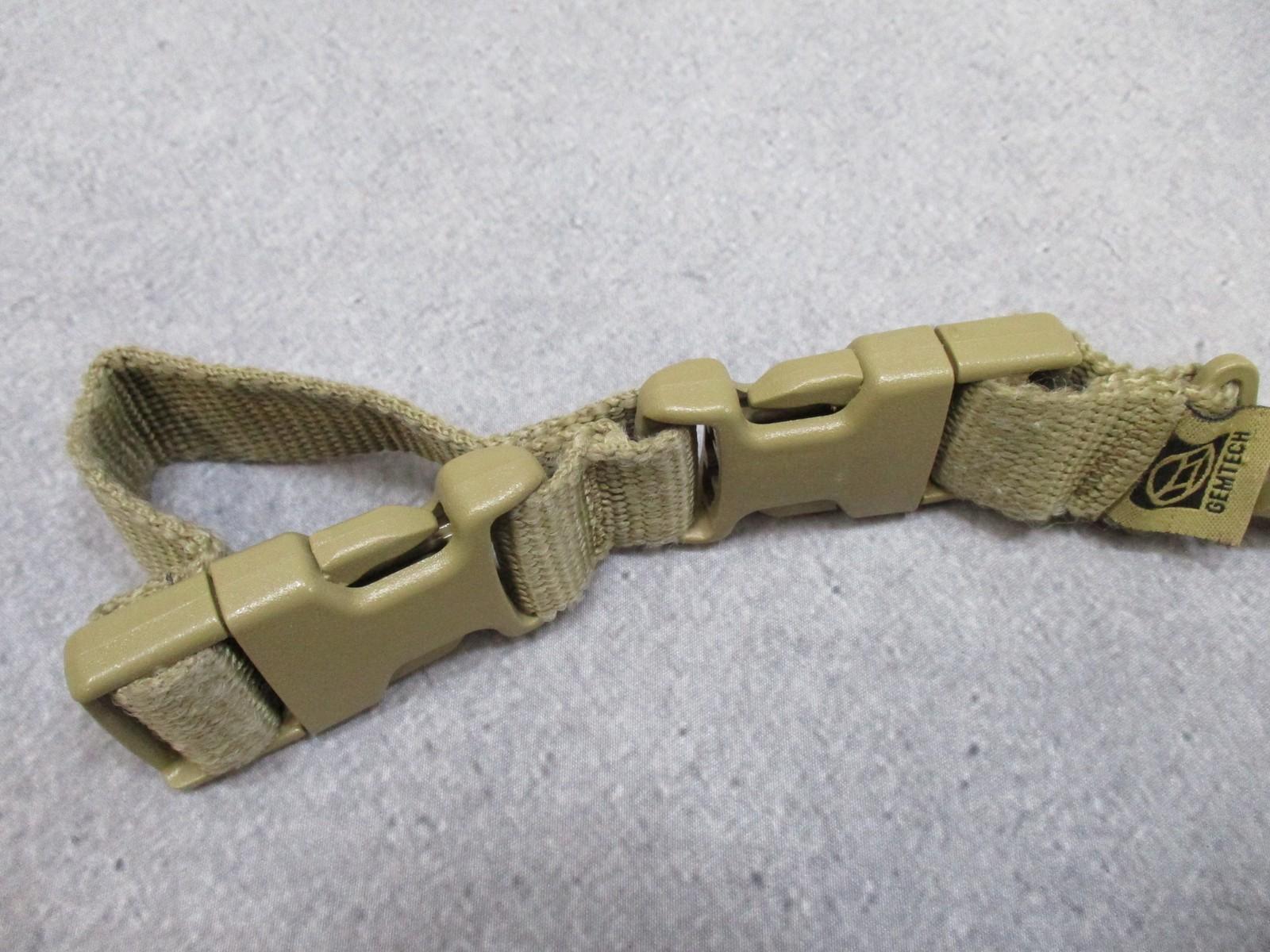 Tan Gem-Tech pistol lanyard dummy cord from Centex Military Gear with coiled design for tactical duty use.