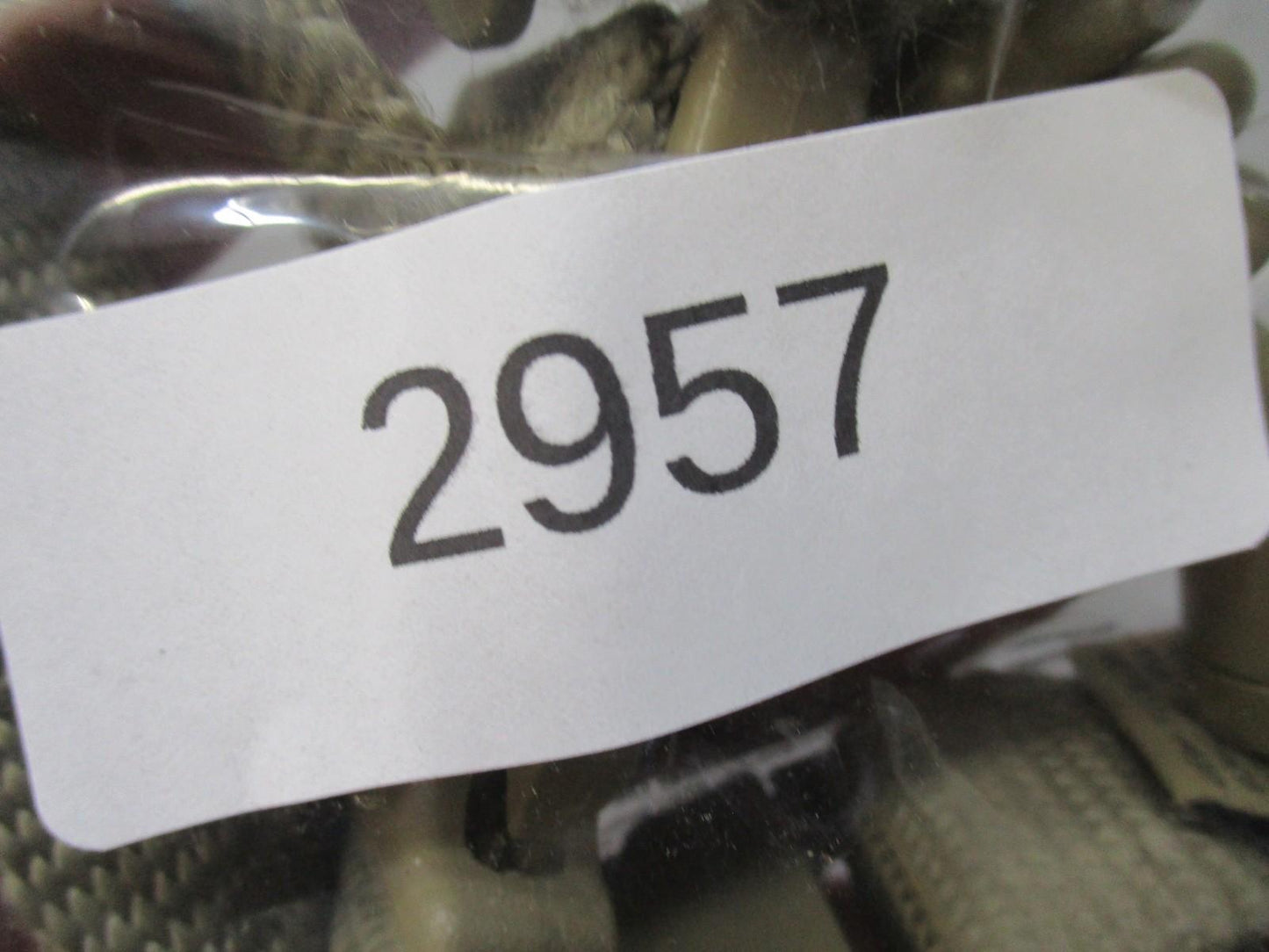 Tan coiled Gem-Tech pistol lanyard dummy cord for tactical duty gear, designed by Centex Military Gear.