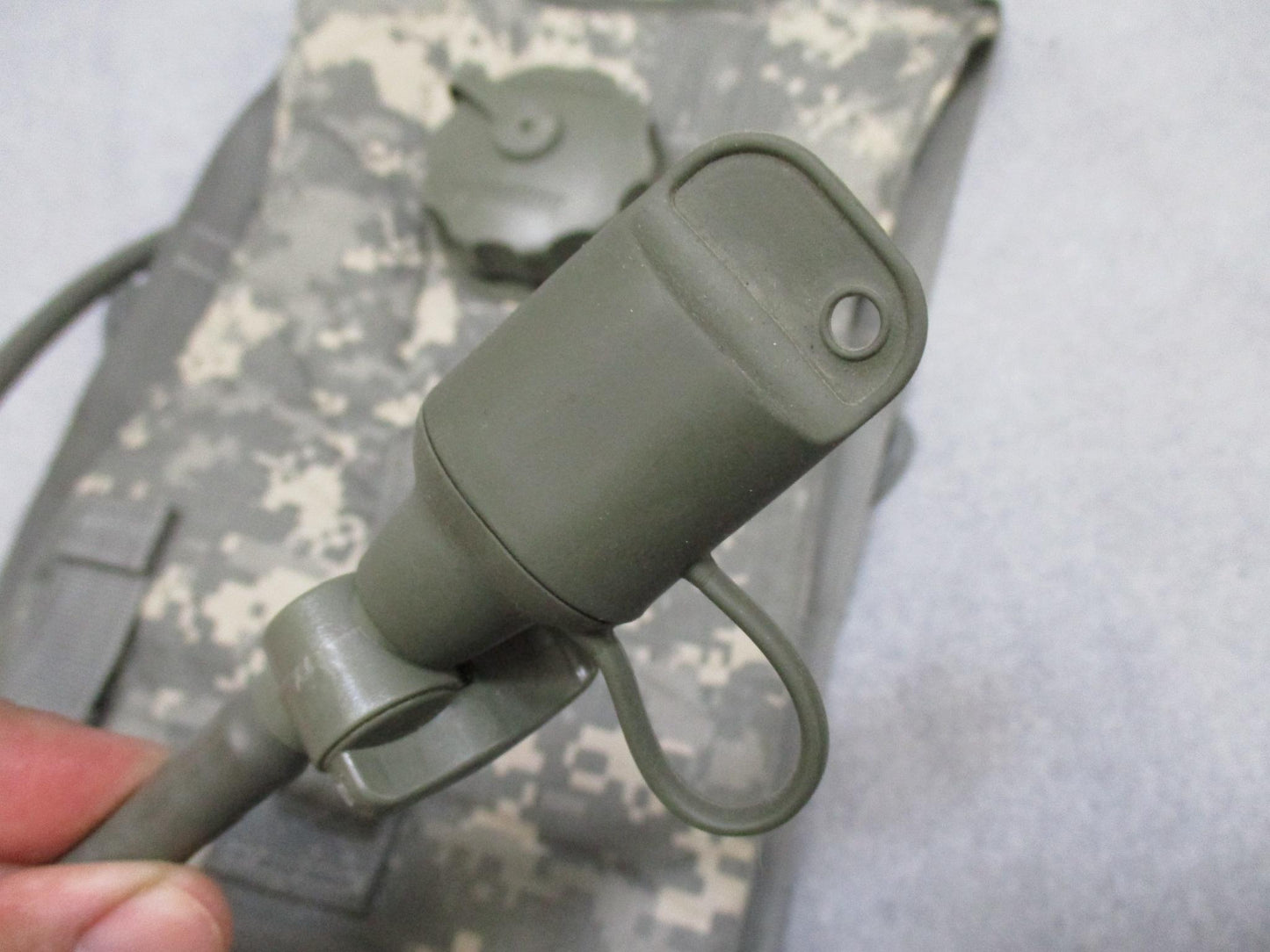 Eagle Industries MOLLE II hydration carrier with US Army digital camouflage, tube, and bite valve, designed for military use.