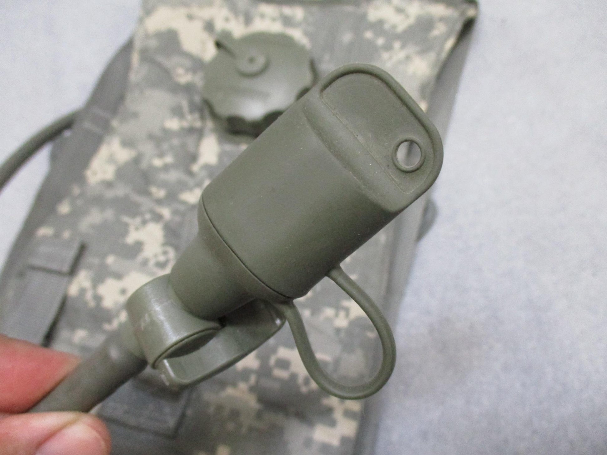 Eagle Industries MOLLE II hydration carrier with US Army digital camouflage, tube, and bite valve, designed for military use.