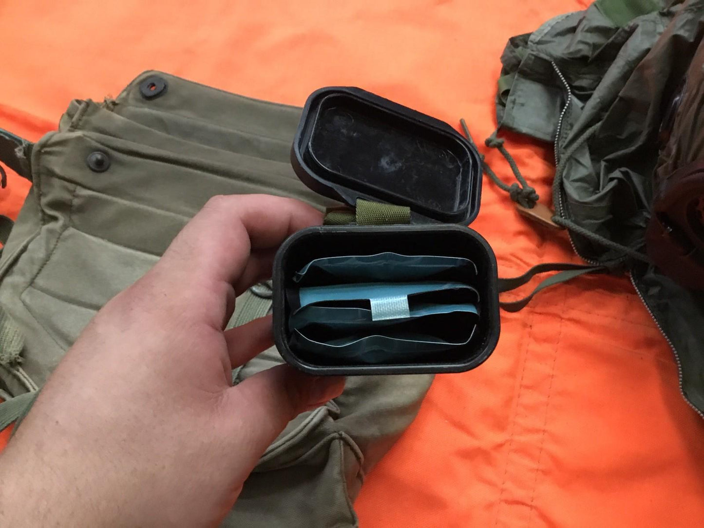 Damaged M17 gas mask display from Centex Military Gear collection, medium size, showing wear and tear on the military mask.