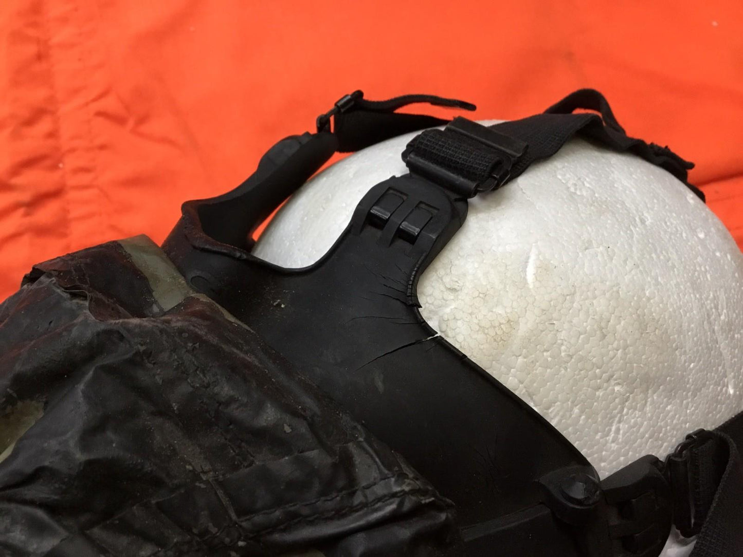 Damaged medium-sized M17 gas mask from Centex Military Gear collection, displayed with visible wear and tear.