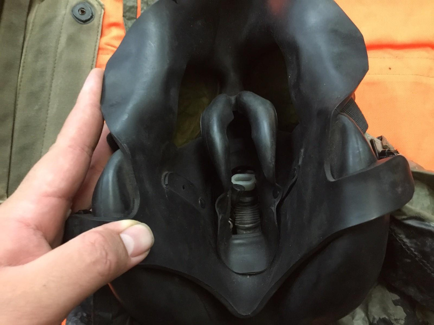 Damaged medium-sized M17 gas mask from Centex Military Gear collection, used for display, showing signs of wear and tear.