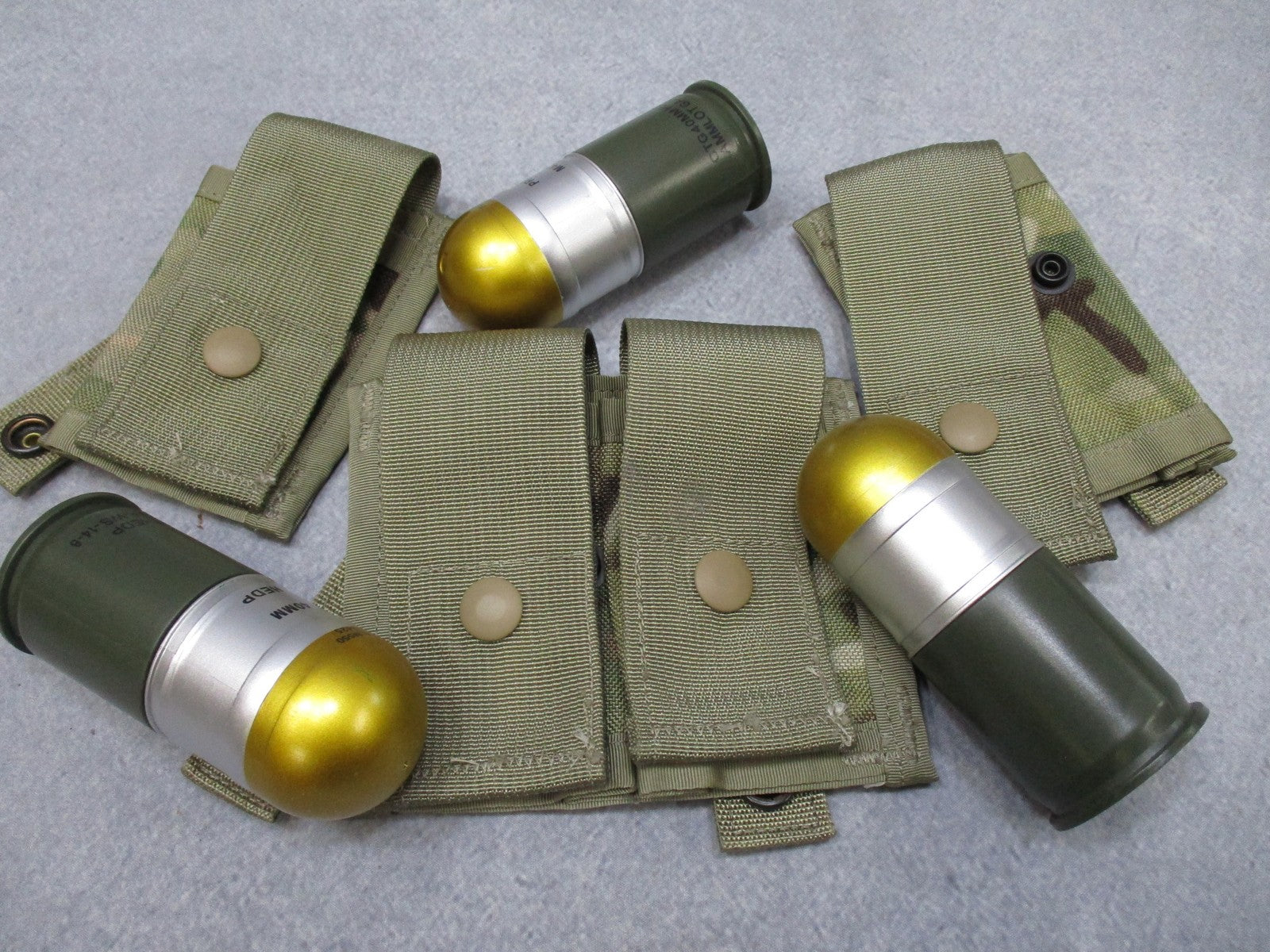Centex Military Gear USGI MOLLE II 40mm grenade pouch set in Multicam, with one double and two single pouches for tactical gear.