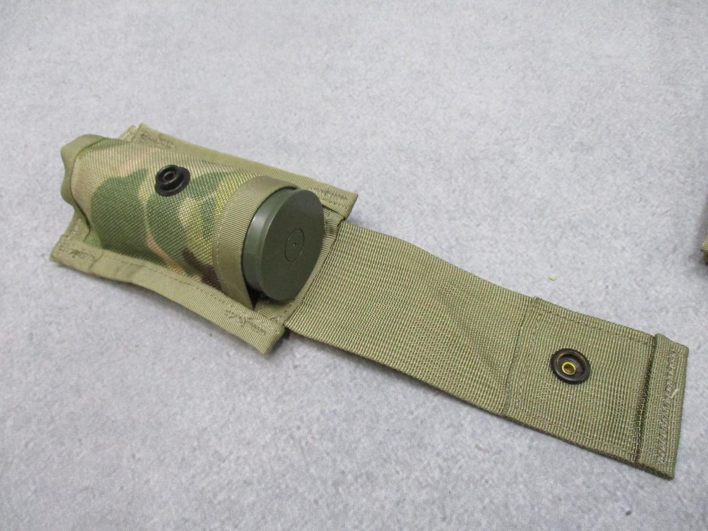 USGI MOLLE II 40mm grenade pouch set in Multicam, includes one double and two single pouches for military gear storage