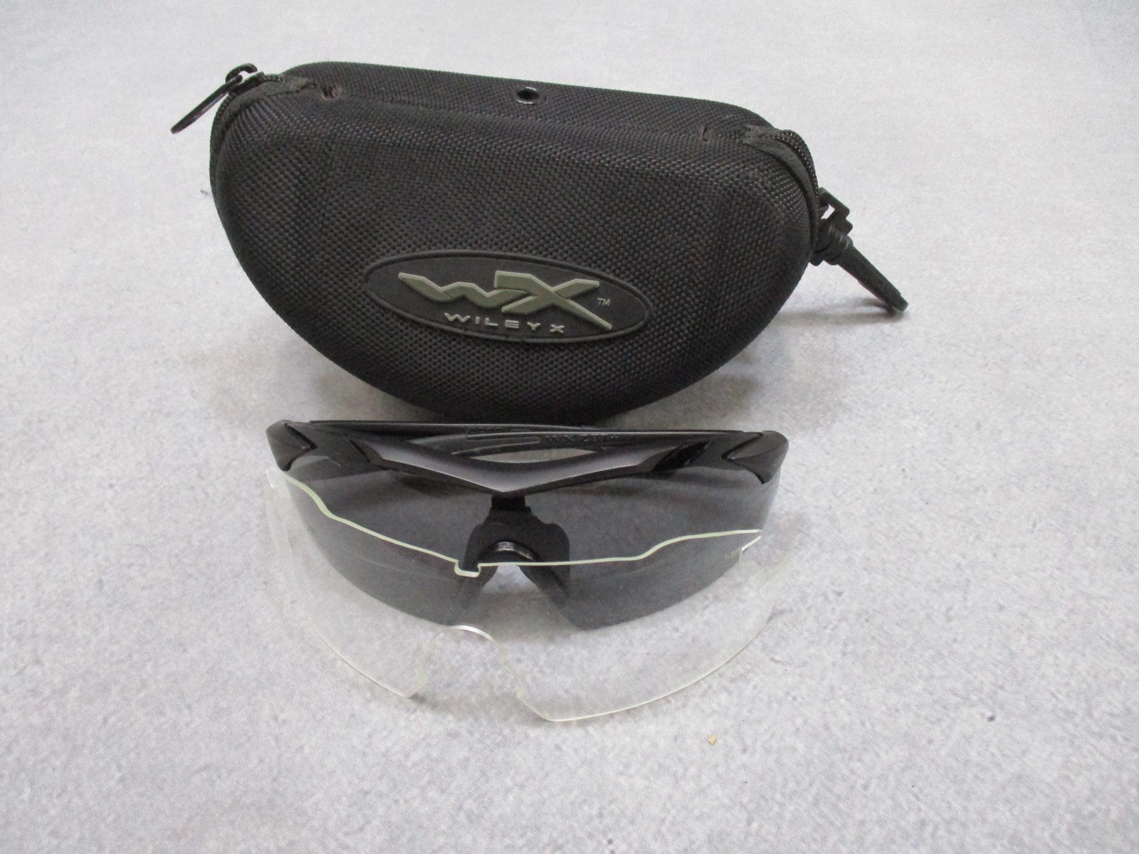 Wiley X Vapor sunglasses with interchangeable lenses and case, featuring wraparound design and black frame, used condition.