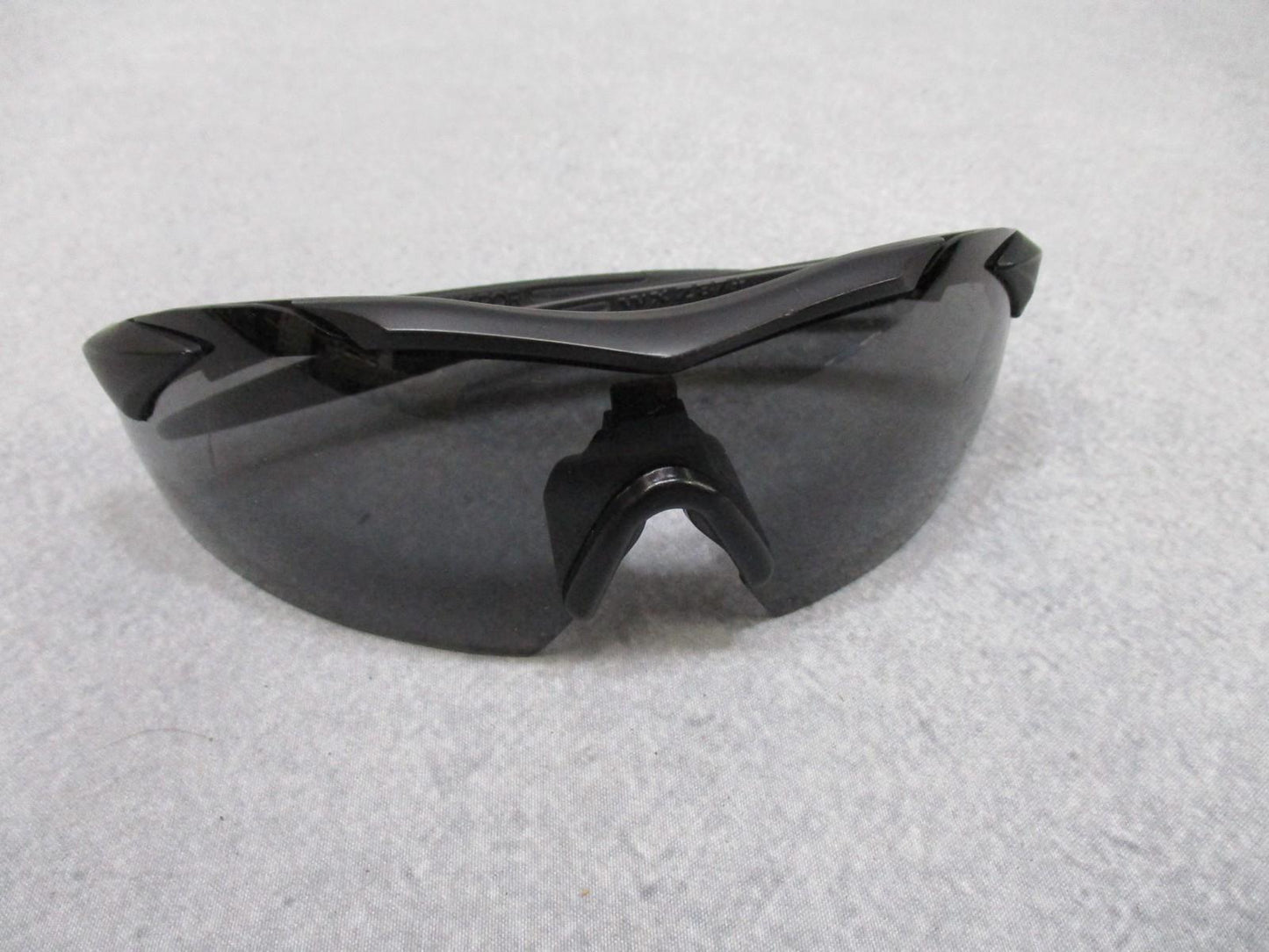 Used Wiley X Vapor sunglasses with interchangeable lenses and case, featuring durable frame and sporty style for outdoor protection.